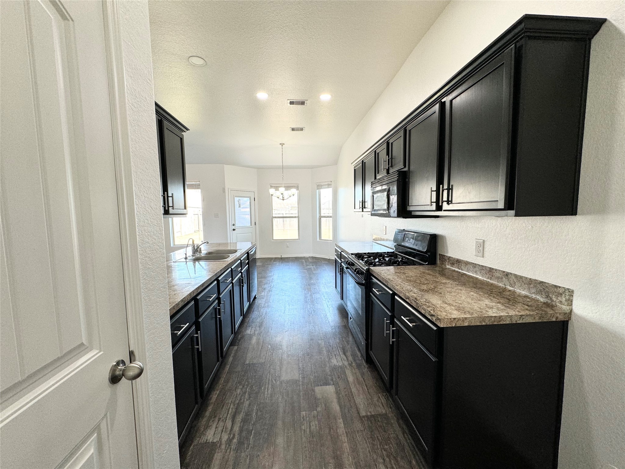 20626 Rimini River Way Katy, TX 77449 - Photo 11 of 21 a kitchen with stainless steel appliances granite countertop a stove a sink and a refrigerator