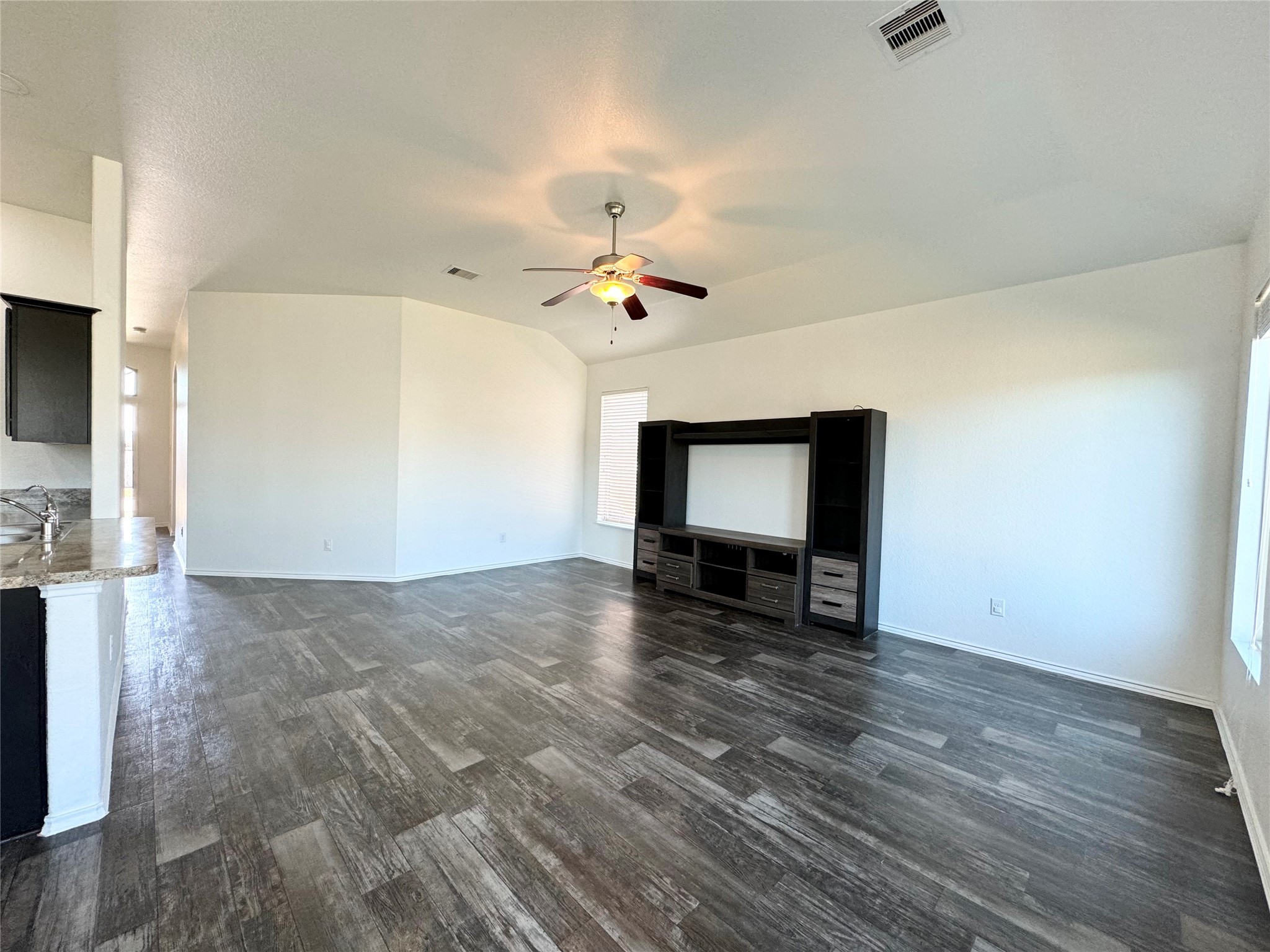 20626 Rimini River Way Katy, TX 77449 - Photo 12 of 21 a view of an empty room with a window and a fireplace