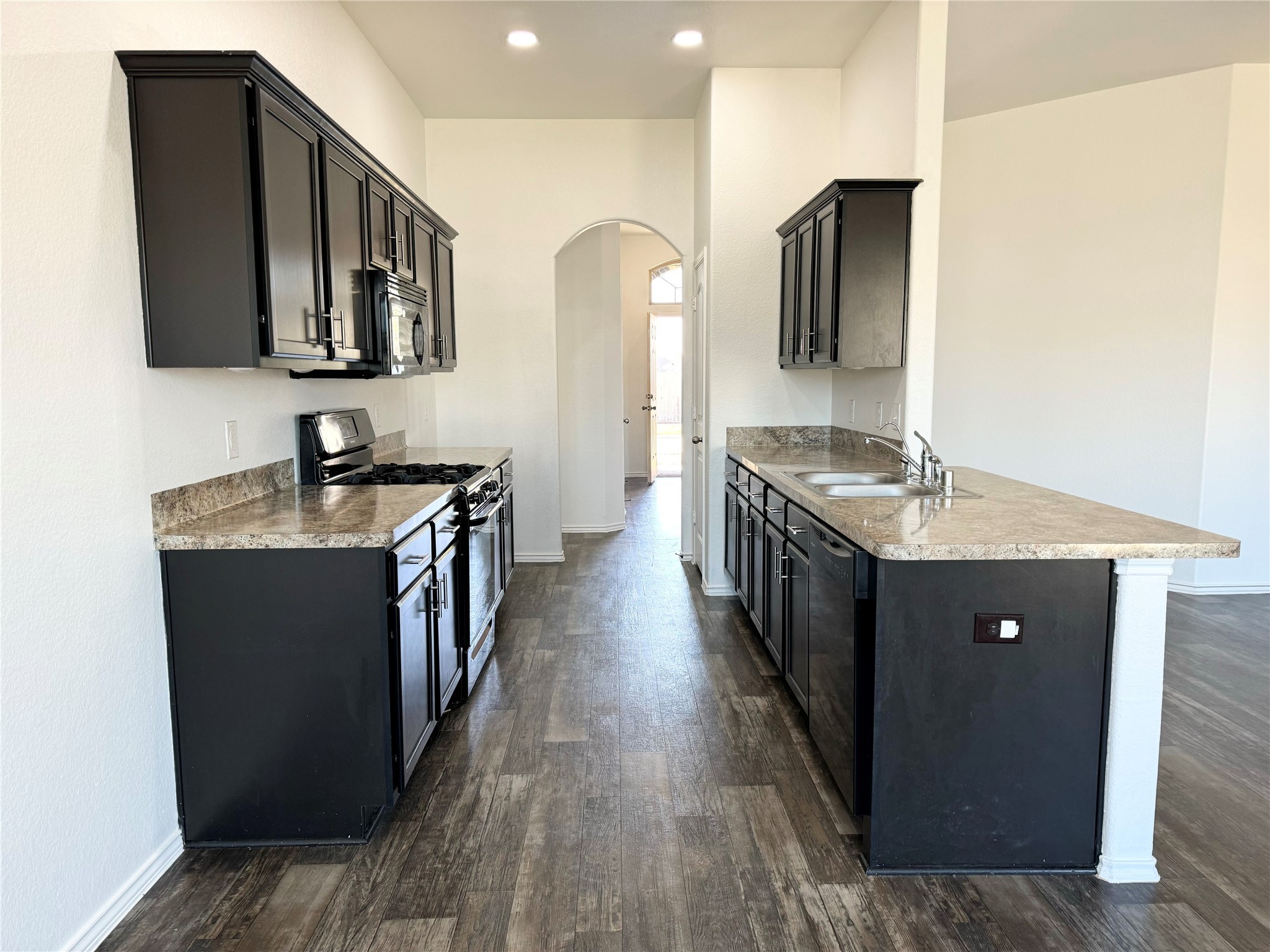 20626 Rimini River Way Katy, TX 77449 - Photo 14 of 21 a kitchen with stainless steel appliances granite countertop a refrigerator a stove and a sink