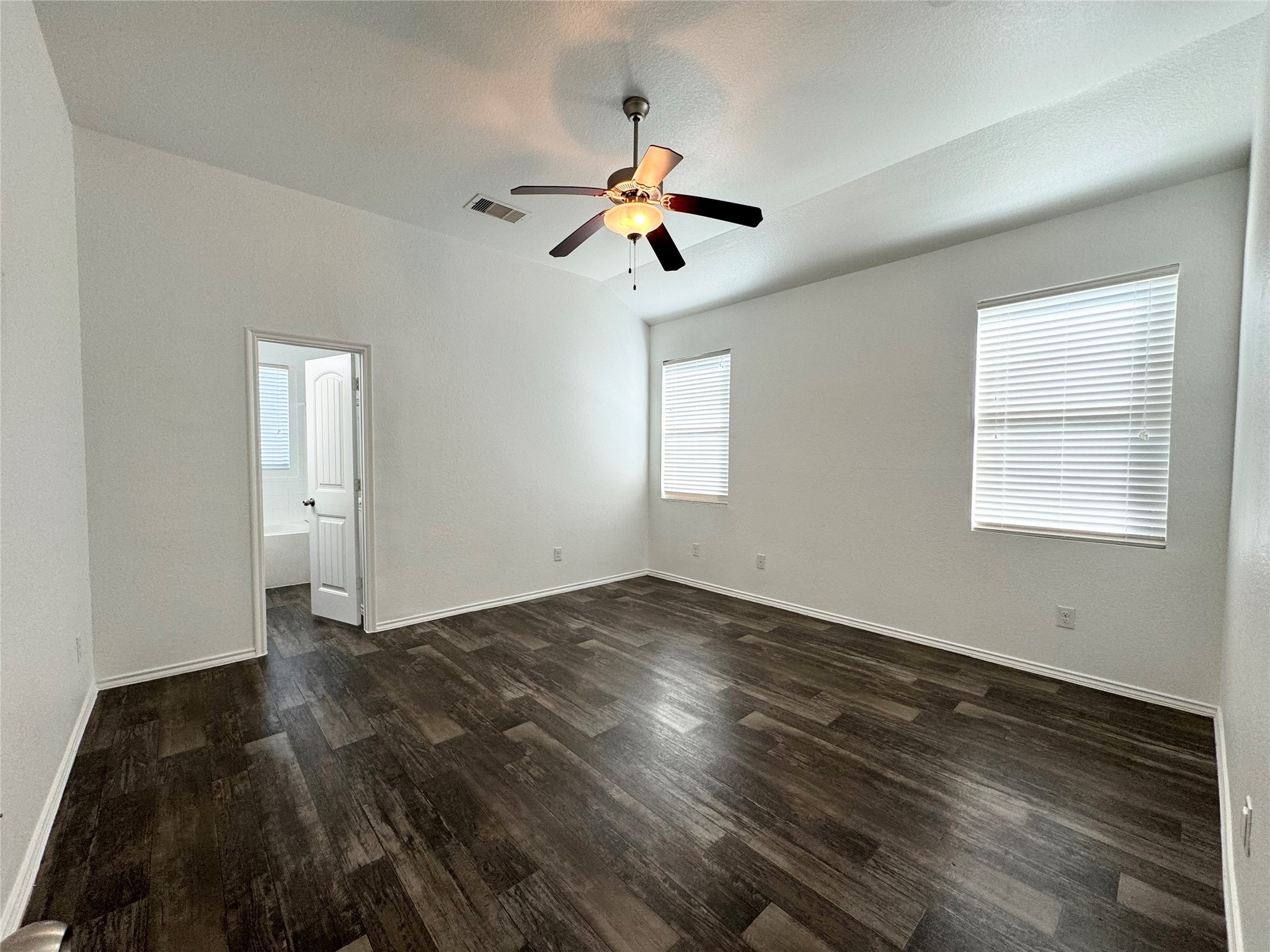 20626 Rimini River Way Katy, TX 77449 - Photo 15 of 21 a view of empty room with wooden floor and fan