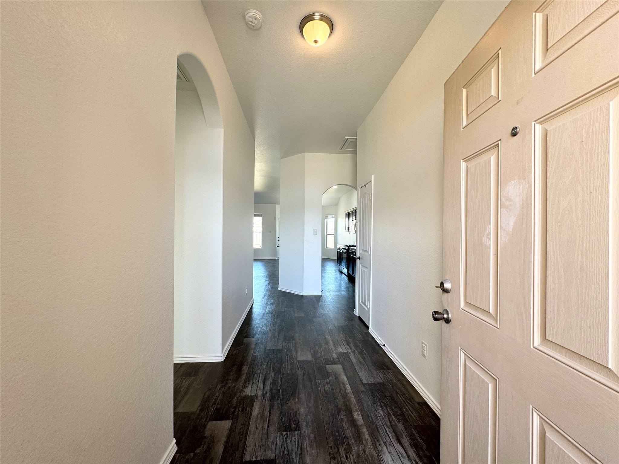 20626 Rimini River Way Katy, TX 77449 - Photo 3 of 21 a view of a hallway with wooden floor and staircase