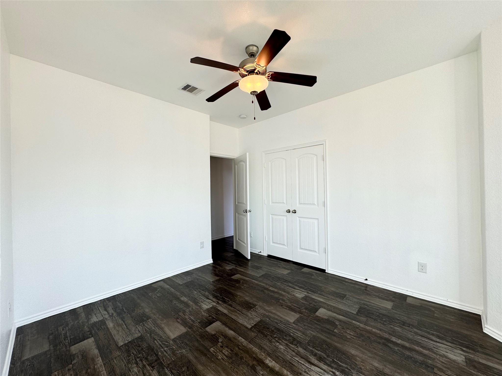 20626 Rimini River Way Katy, TX 77449 - Photo 5 of 21 a view of empty room with wooden floor