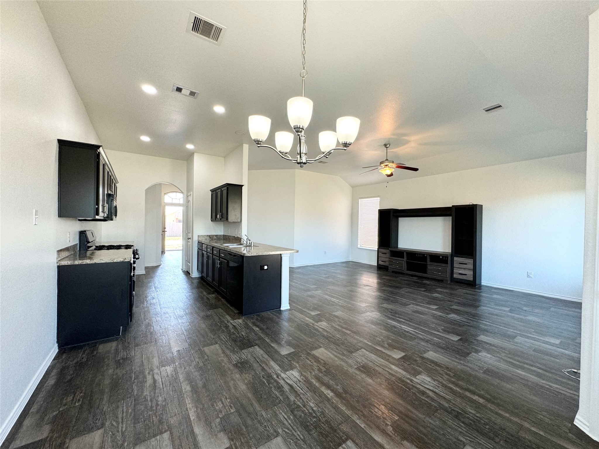 20626 Rimini River Way Katy, TX 77449 - Photo 10 of 21 a large kitchen with a sink and dishwasher a stove top oven with wooden floor