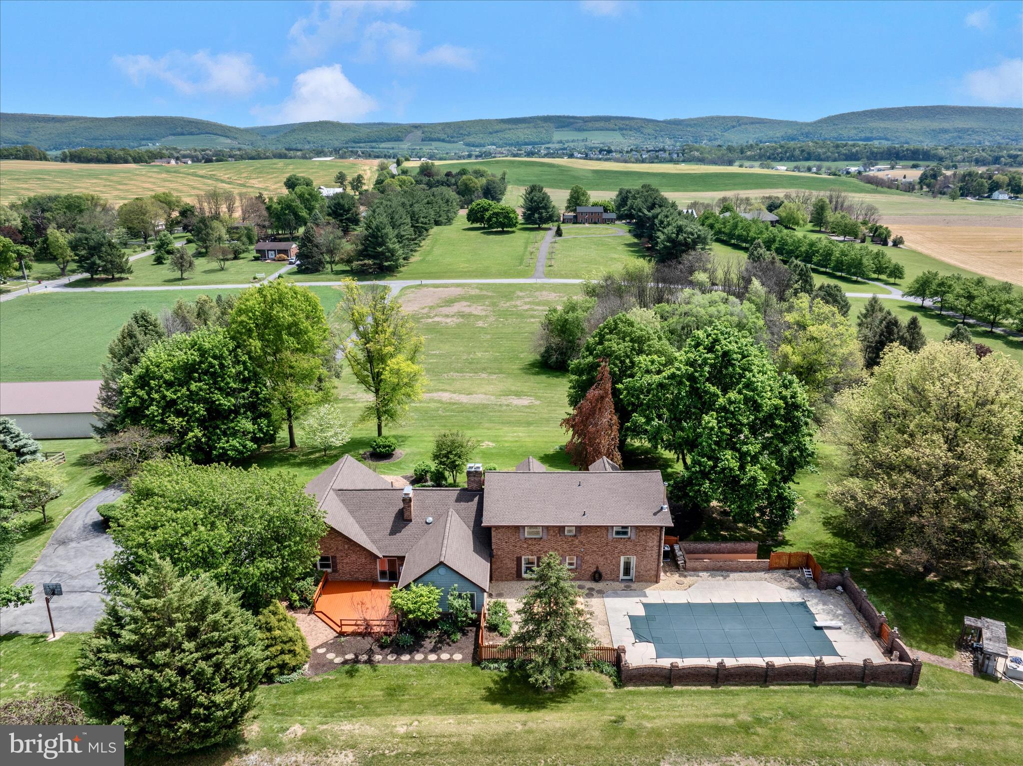 13008 Still Meadow Road Smithsburg, MD 21783 - Photo 2 of 60 an aerial view of a house with a garden and lake view