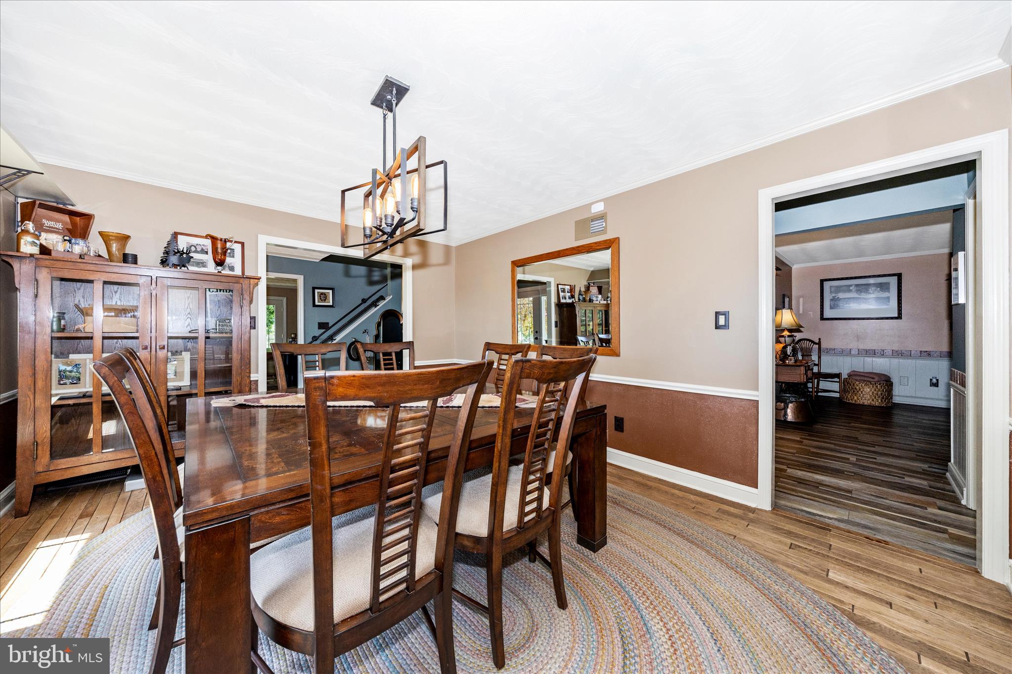 13008 Still Meadow Road Smithsburg, MD 21783 - Photo 25 of 60 a view of a dining room with furniture and wooden floor