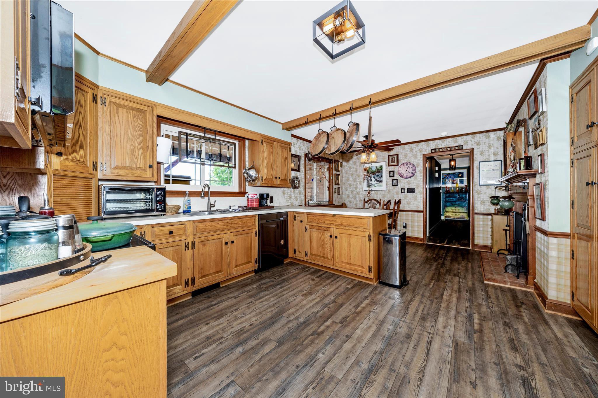13008 Still Meadow Road Smithsburg, MD 21783 - Photo 27 of 60 a kitchen that has a lot of cabinets a sink and a stove in it