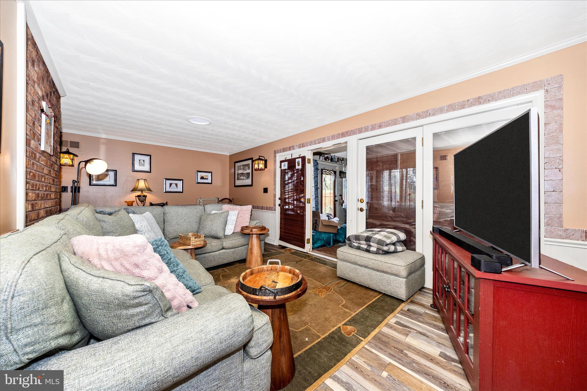 13008 Still Meadow Road Smithsburg, MD 21783 - Photo 34 of 60 a living room with furniture and a flat screen tv