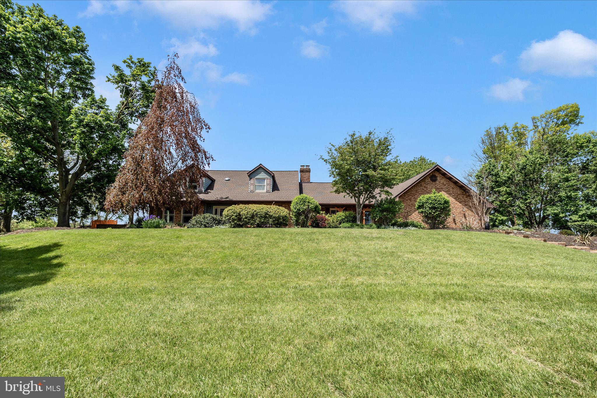 13008 Still Meadow Road Smithsburg, MD 21783 - Photo 4 of 60 a front view of a house with a yard and trees