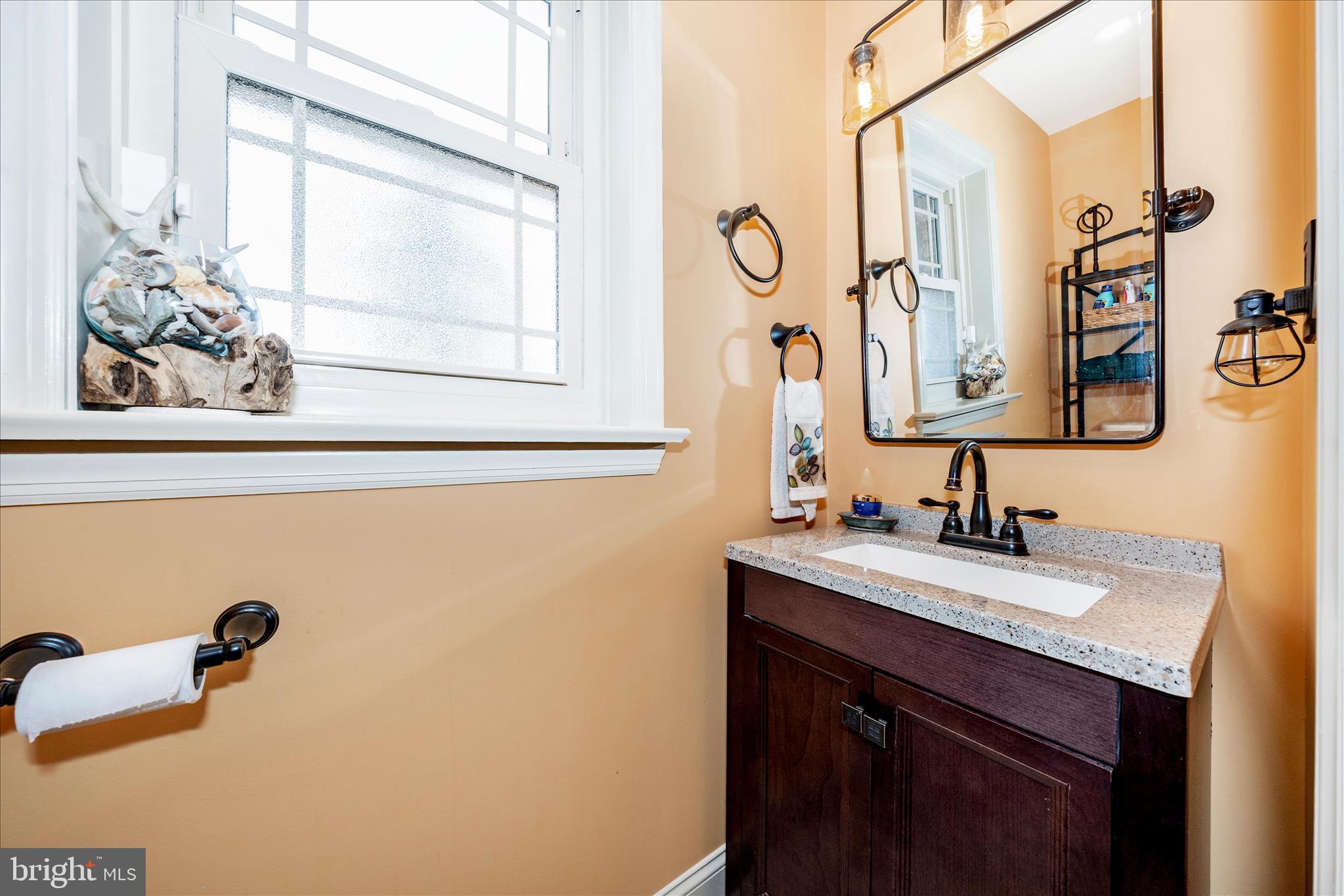 13008 Still Meadow Road Smithsburg, MD 21783 - Photo 41 of 60 a bathroom with a sink and a mirror