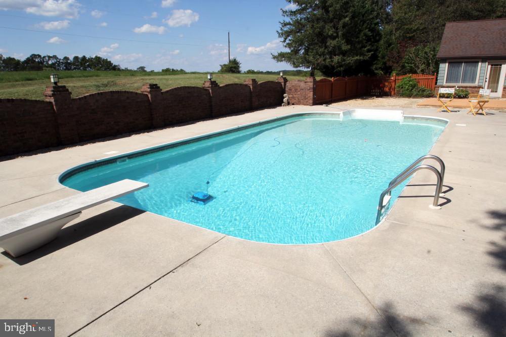 13008 Still Meadow Road Smithsburg, MD 21783 - Photo 60 of 60 a view of a swimming pool with an outdoor seating