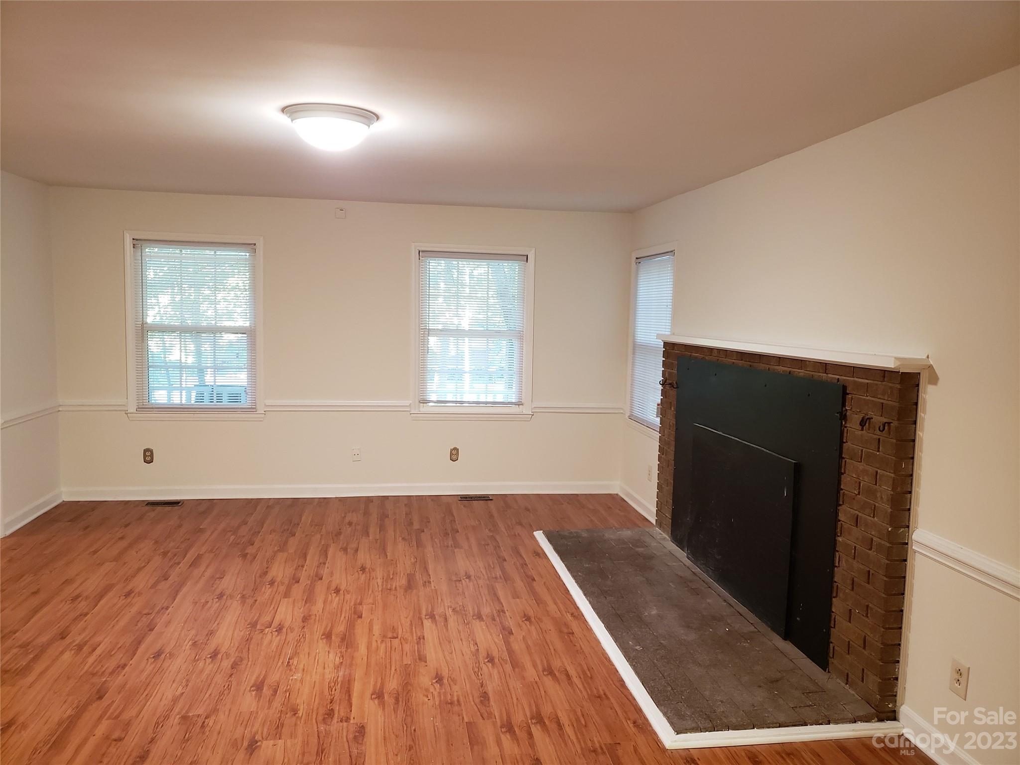800 Silverleaf Road Charlotte, NC 28217 - Photo 3 of 6 wooden floor in an empty room with a window