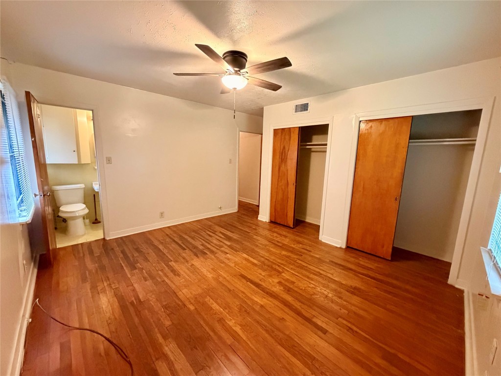 6211 Schevers Street Houston, TX 77087 - Photo 17 of 28 a view of an empty room with wooden floor and a window