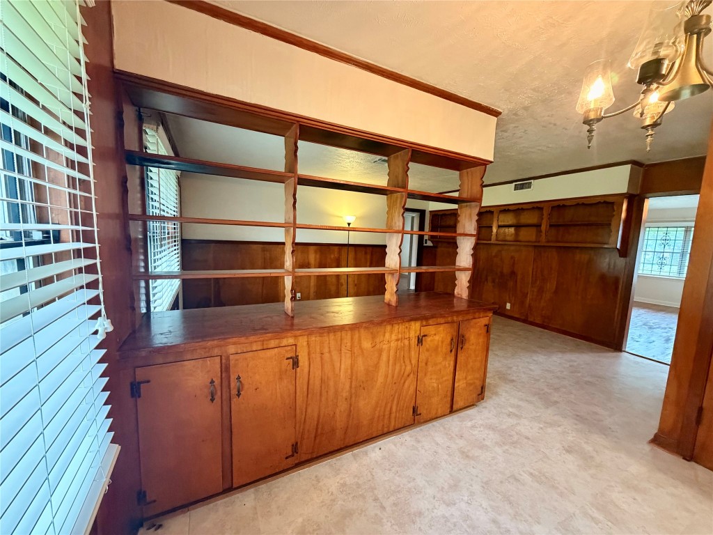 6211 Schevers Street Houston, TX 77087 - Photo 20 of 28 a view of an empty room with wooden floor and furniture