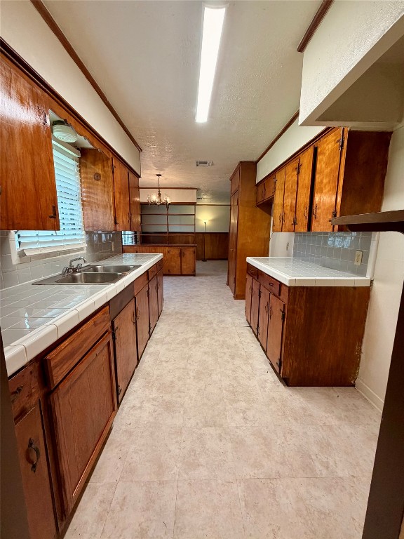 6211 Schevers Street Houston, TX 77087 - Photo 23 of 28 a kitchen with stainless steel appliances a sink and a stove
