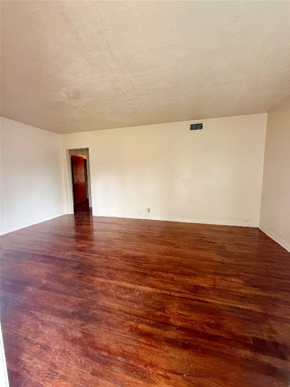 6211 Schevers Street Houston, TX 77087 - Photo 5 of 28 a view of an empty room and wooden floor