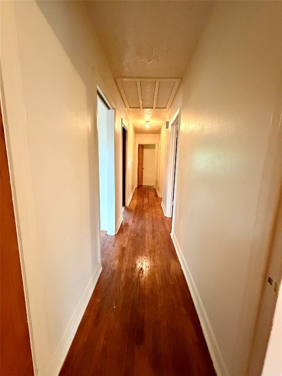 6211 Schevers Street Houston, TX 77087 - Photo 7 of 28 a view of a hallway with wooden floor and staircase