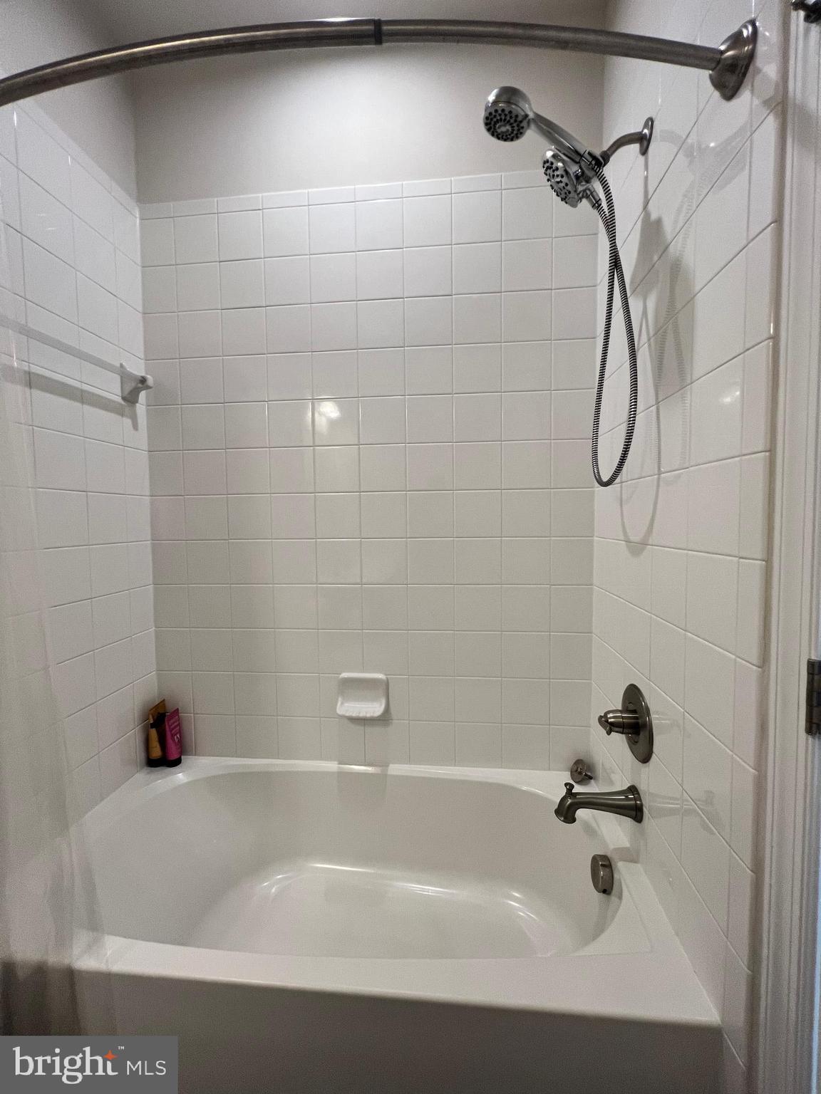 1331 Bruley Road Hanover, MD 21076 - Photo 13 of 18 a bathroom with a bath tub with a shower