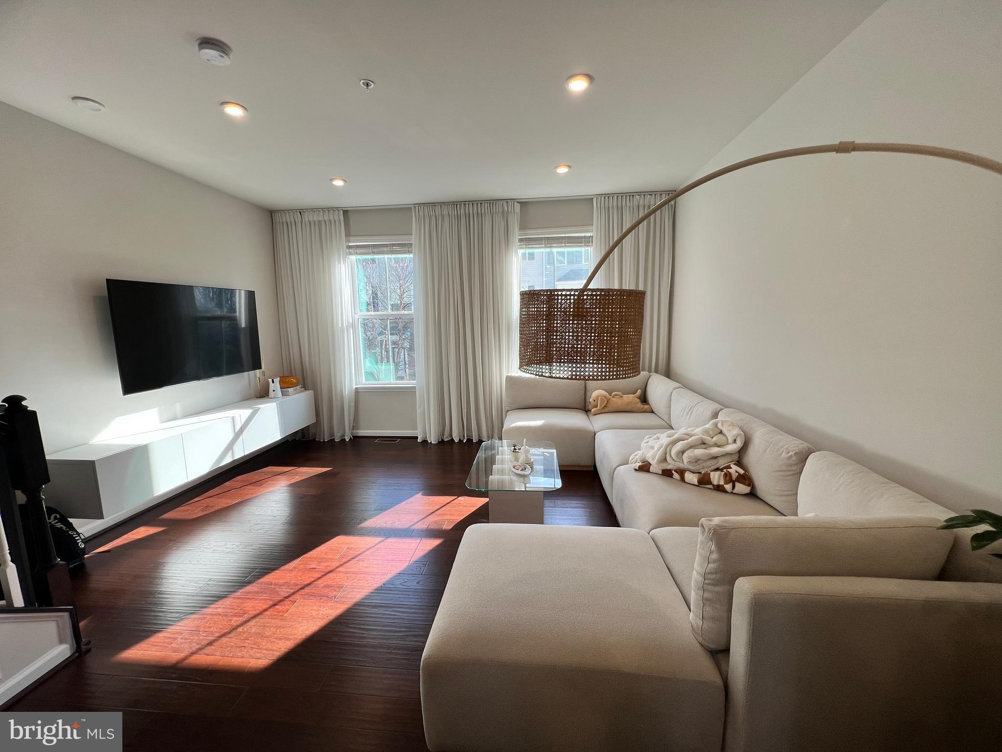 1331 Bruley Road Hanover, MD 21076 - Photo 14 of 18 a living room with furniture and a flat screen tv