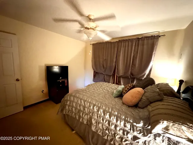 a bedroom with a bed and a closet