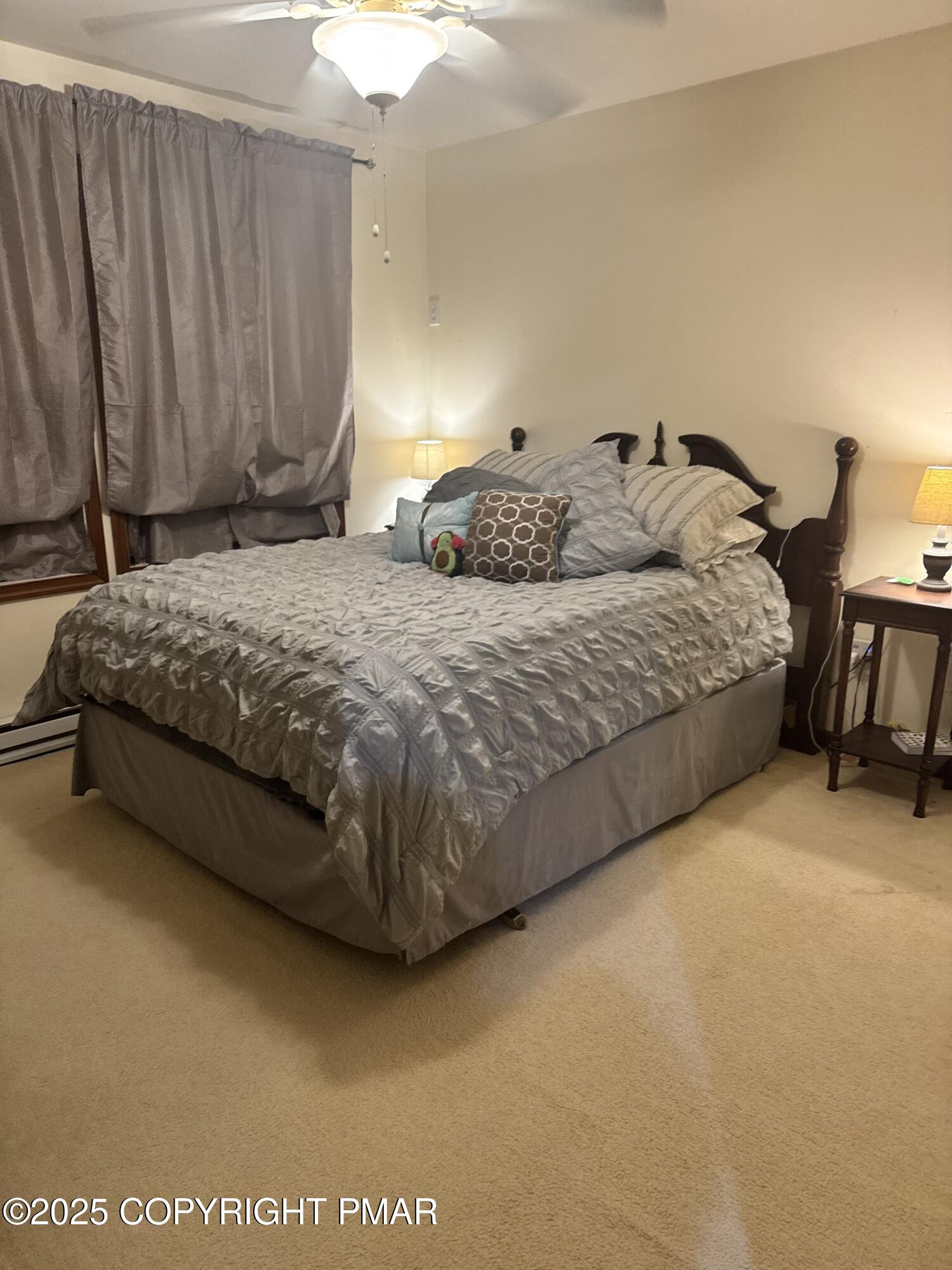 102 Indian Trail Road Jim Thorpe, PA 18229 - Photo 17 of 28 a spacious bedroom with a bed and chair