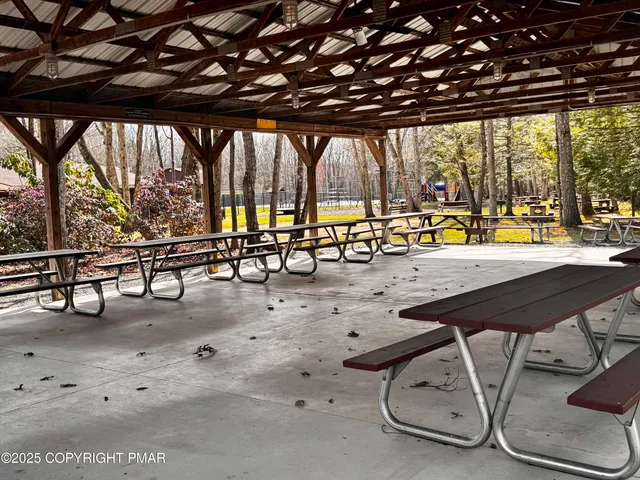 a view of swimming pool with outdoor seating