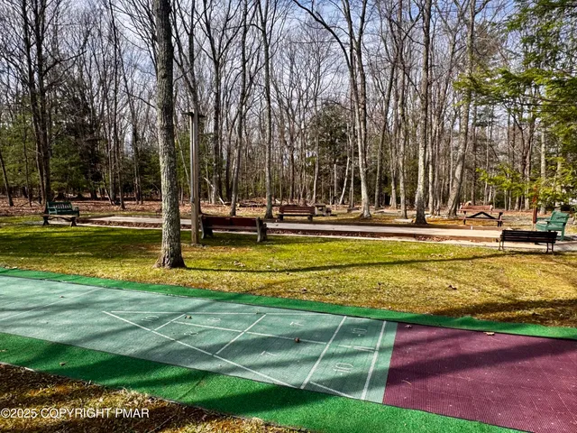 a view of swimming pool with sitting area and entertaining space