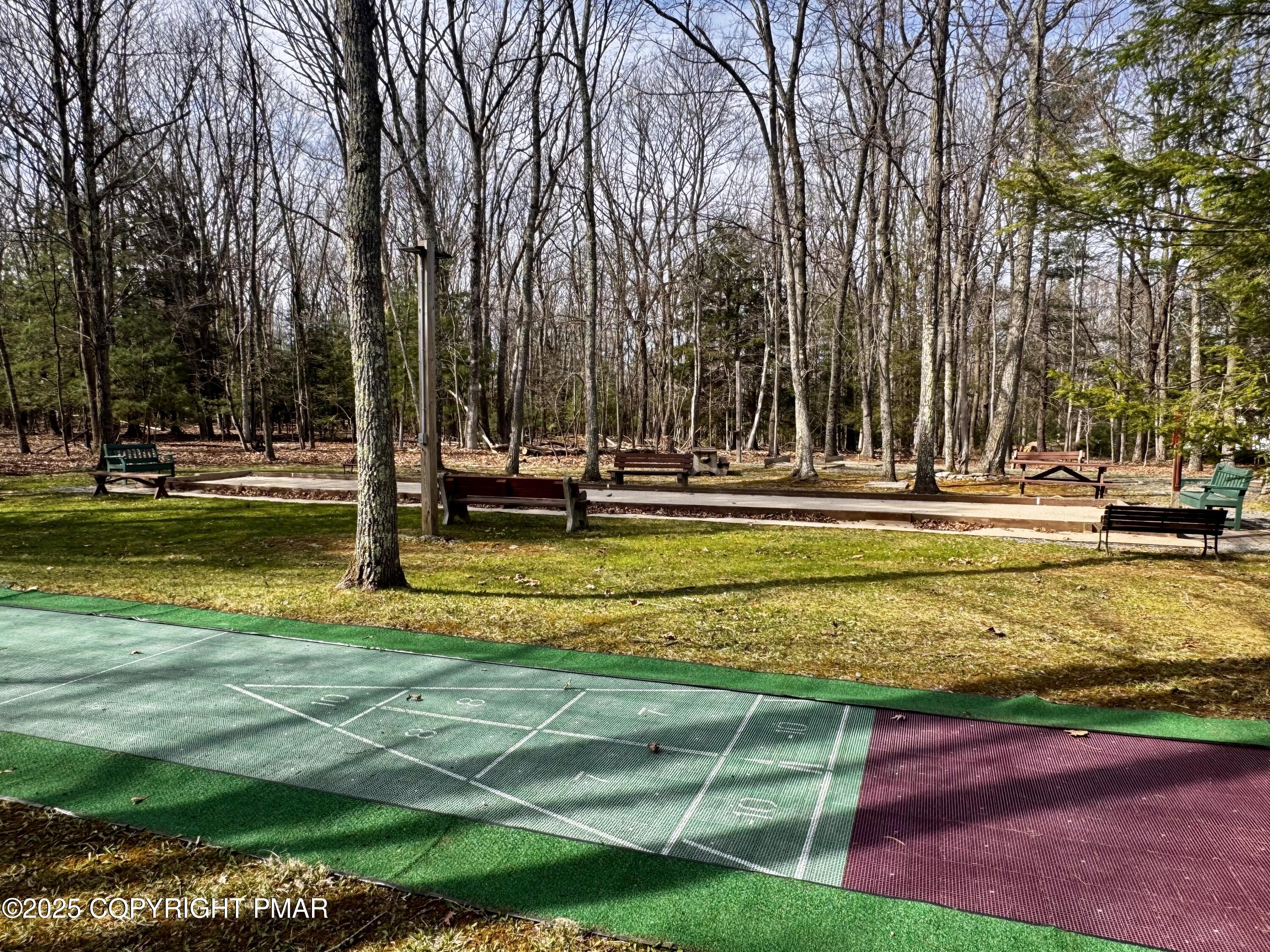 102 Indian Trail Road Jim Thorpe, PA 18229 - Photo 22 of 28 a view of a swimming pool with a lawn chairs and a big yard