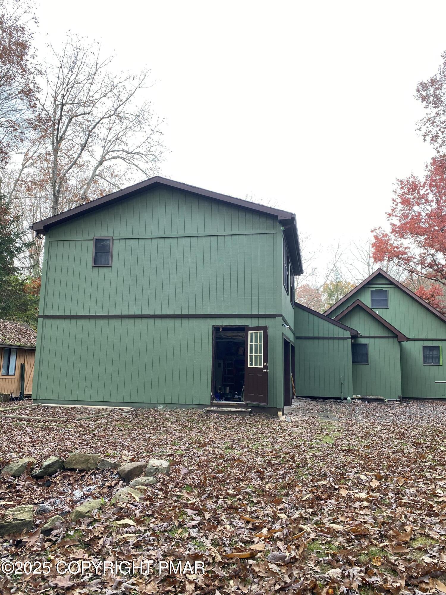 102 Indian Trail Road Jim Thorpe, PA 18229 - Photo 24 of 28 a front view of a house with a garden