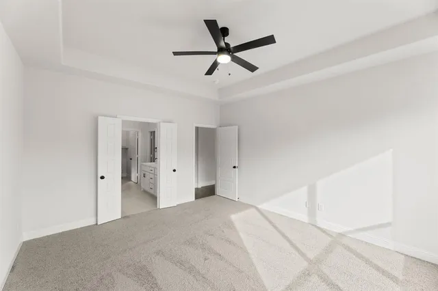 a very nice looking room with a ceiling fan