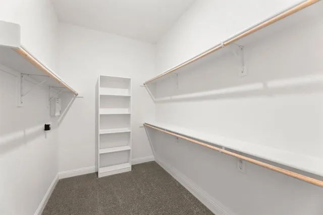a view of an empty walk in closet
