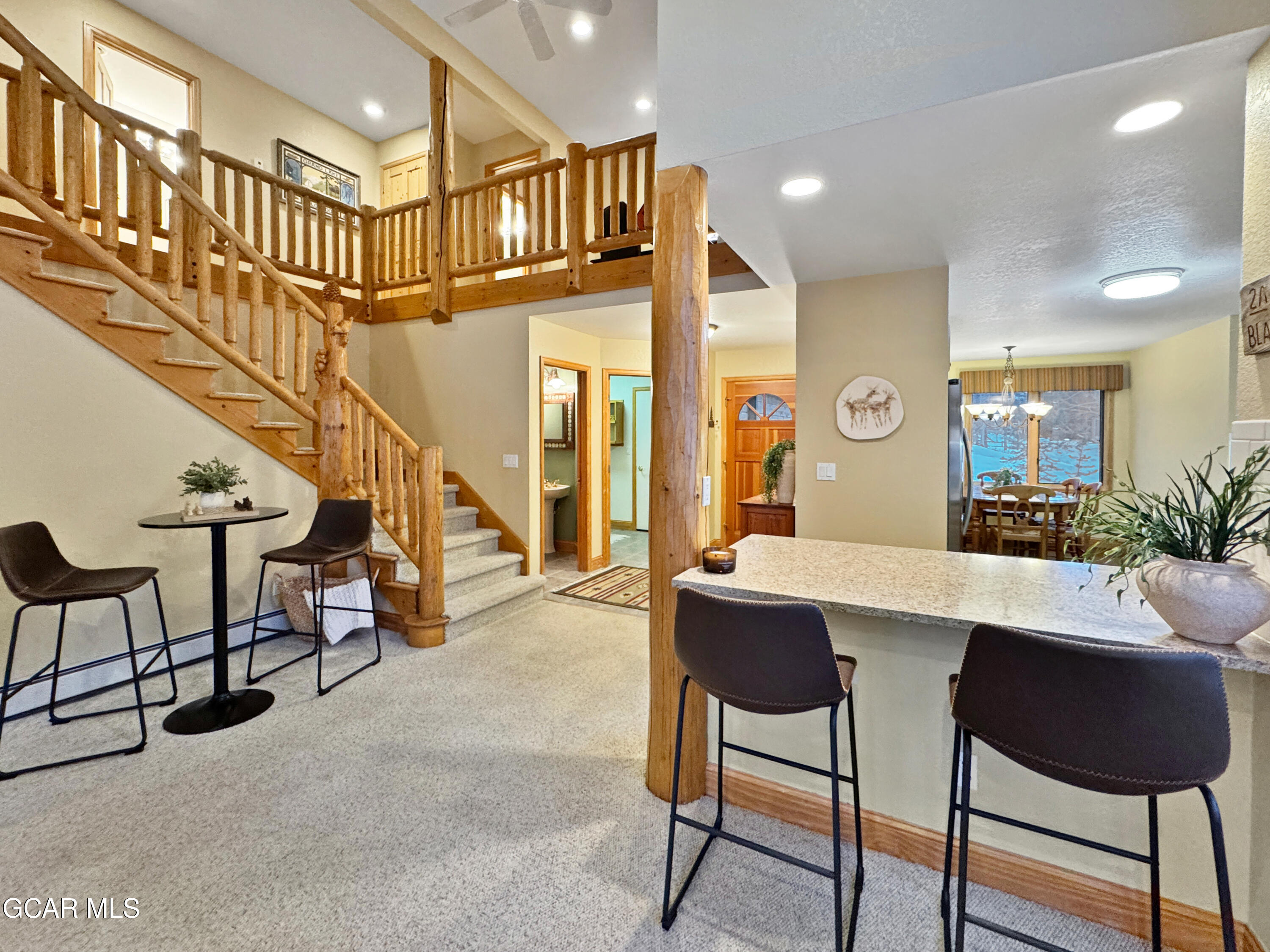 1232 Gcr 8 Tabernash, CO 80478 - Photo 11 of 51 a dining room with furniture and a chandelier
