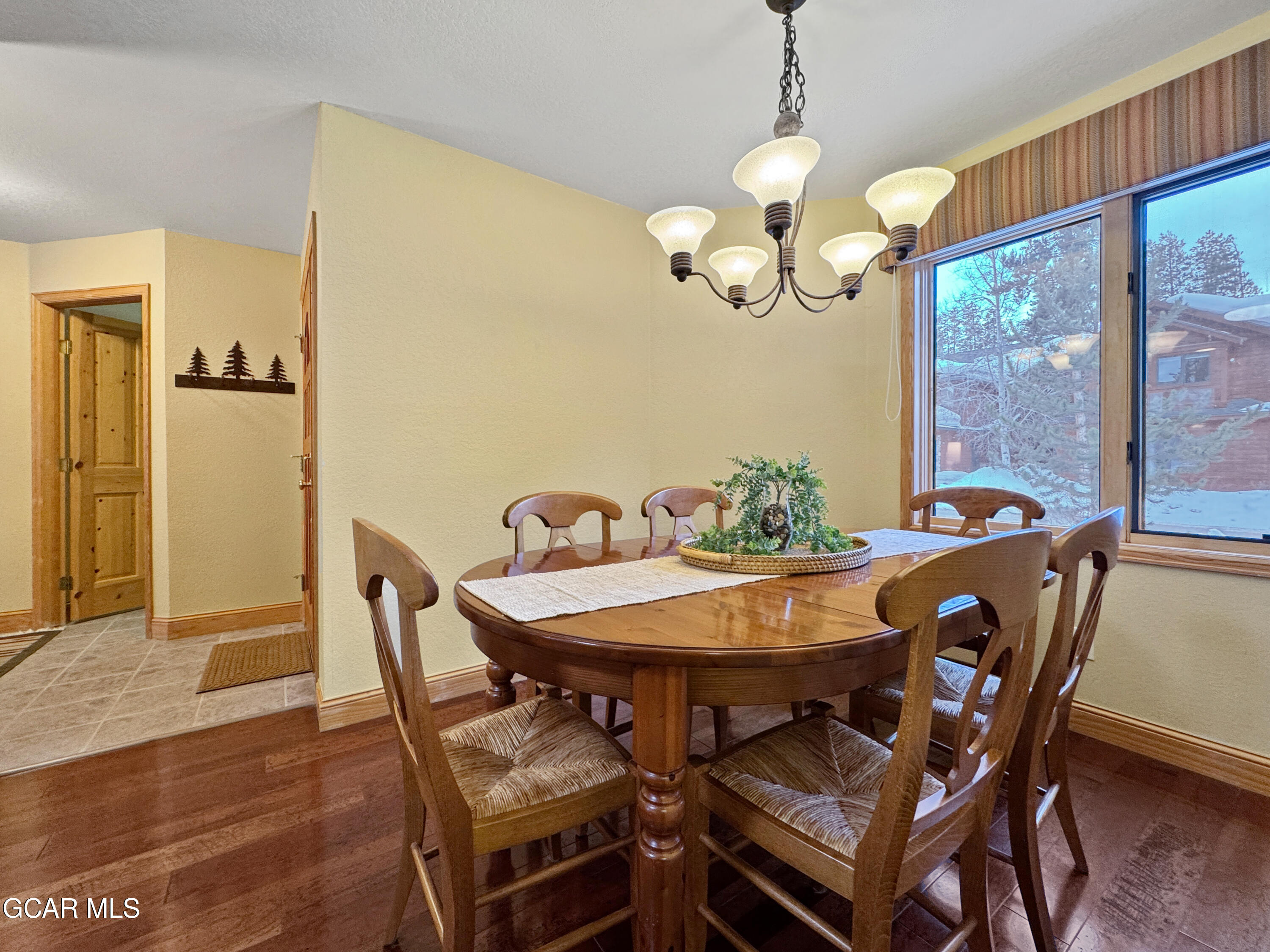 1232 Gcr 8 Tabernash, CO 80478 - Photo 18 of 51 a view of a dining room with furniture window and wooden floor