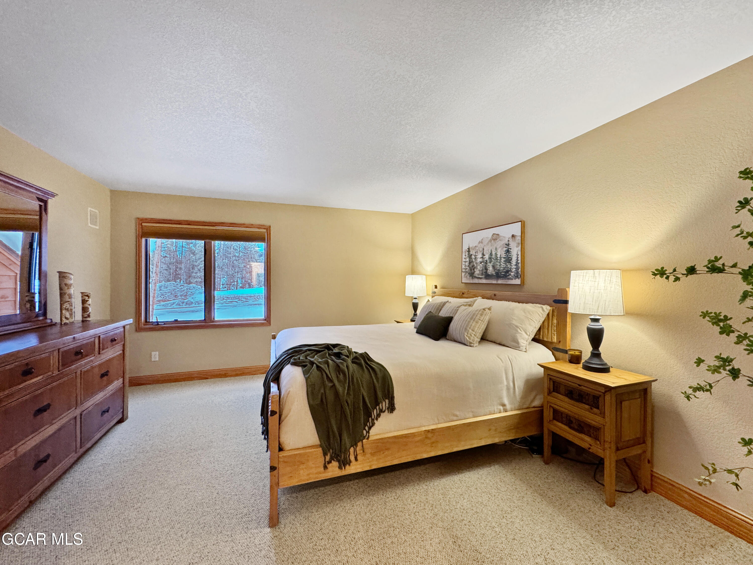 1232 Gcr 8 Tabernash, CO 80478 - Photo 20 of 51 a bedroom with a bed and a dresser in it