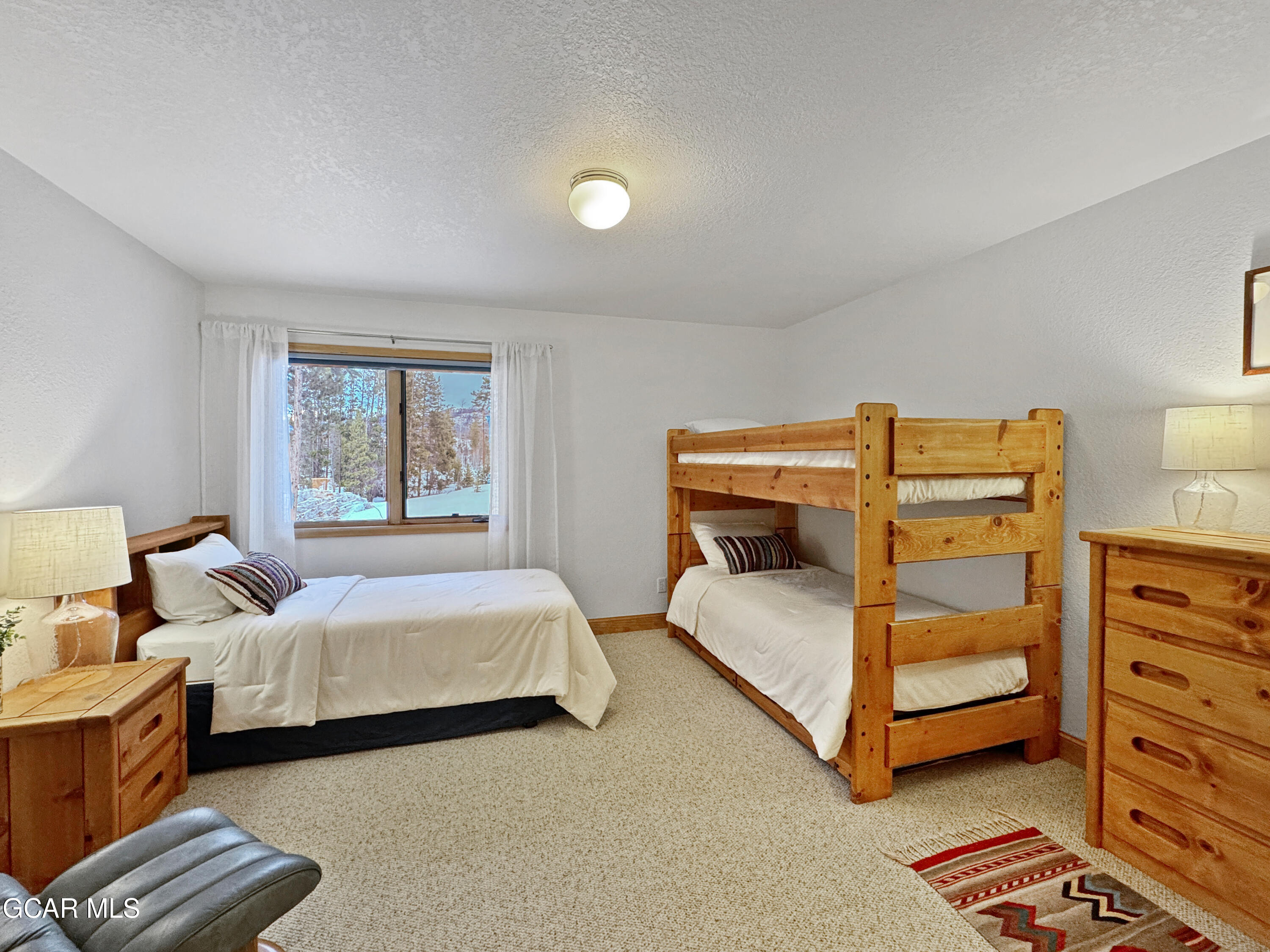 1232 Gcr 8 Tabernash, CO 80478 - Photo 32 of 51 a bedroom with a bed and a dresser