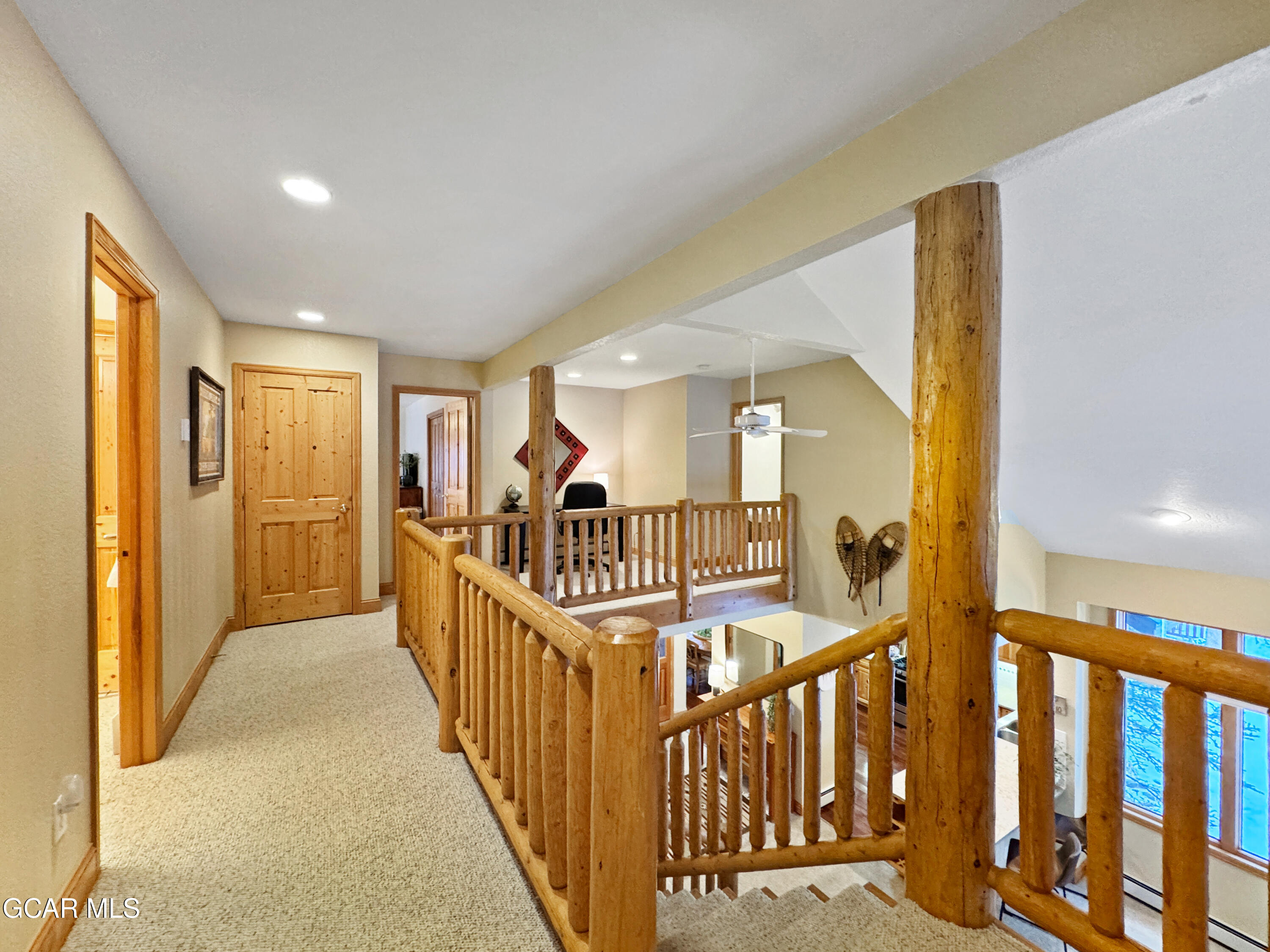 1232 Gcr 8 Tabernash, CO 80478 - Photo 35 of 51 a view of staircase with lots of frames on wall and a large window