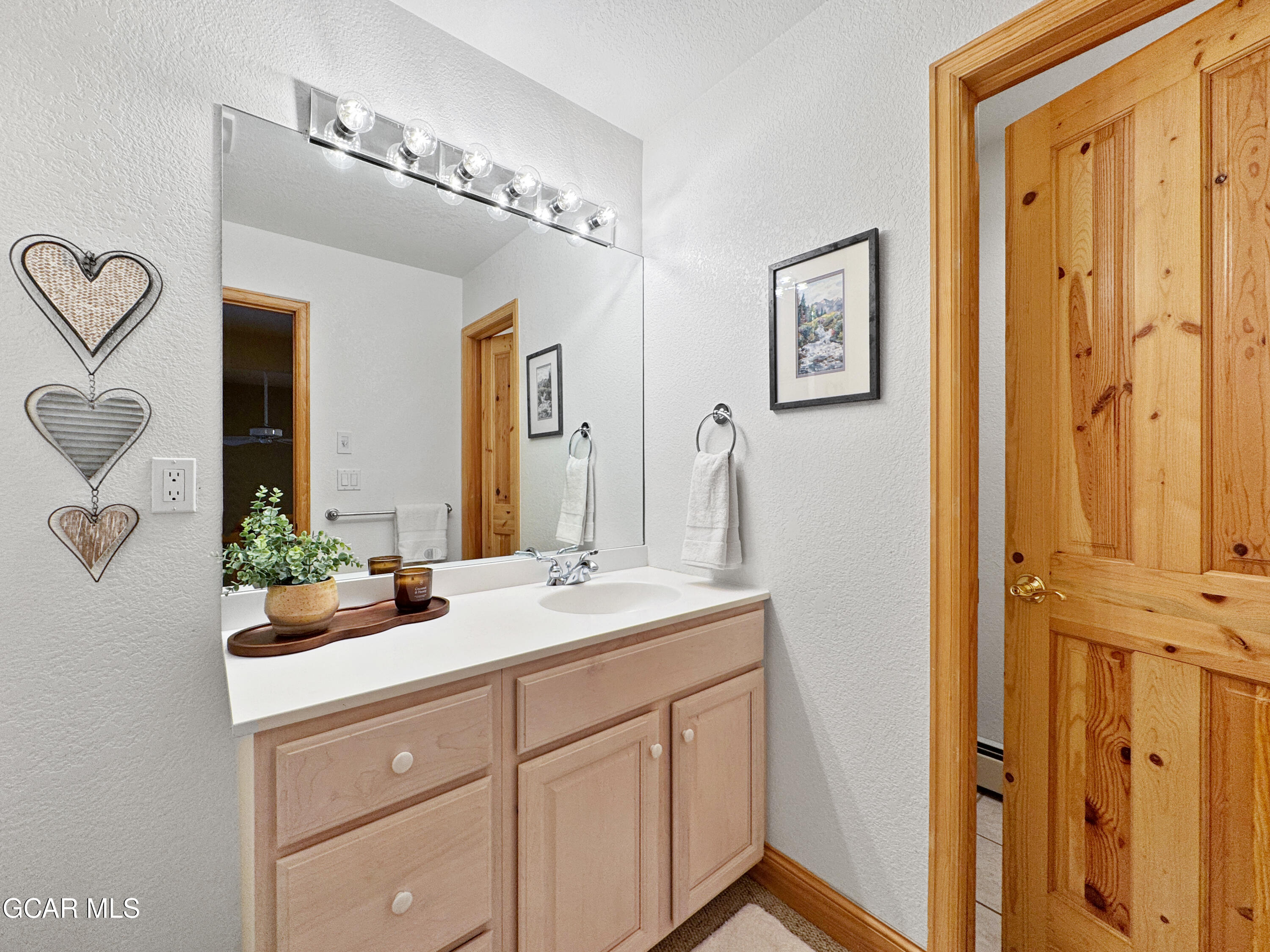1232 Gcr 8 Tabernash, CO 80478 - Photo 36 of 51 a bathroom with a double vanity sink mirror and