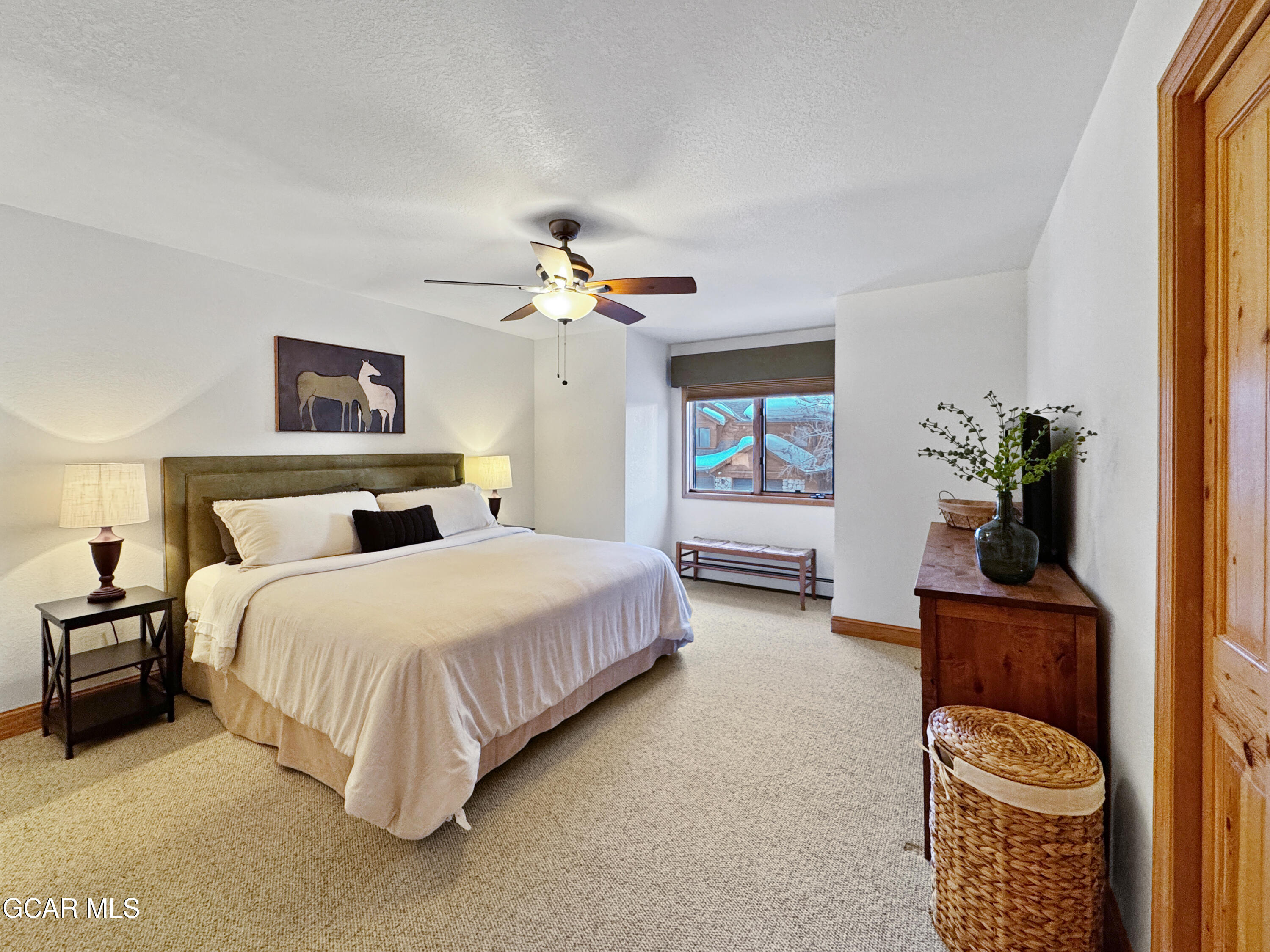 1232 Gcr 8 Tabernash, CO 80478 - Photo 39 of 51 a spacious bedroom with a bed and window