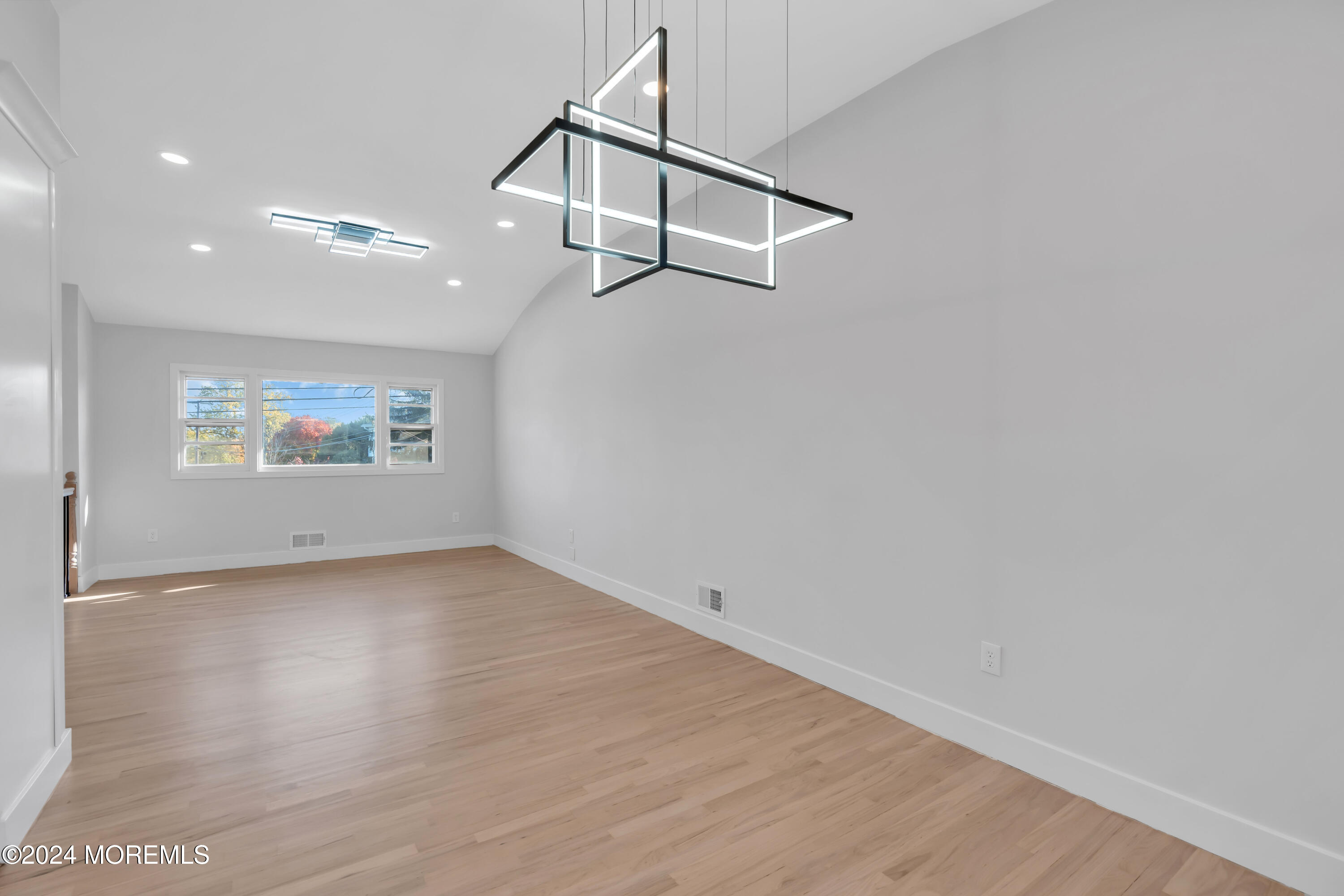 44 Lexington Road Howell, NJ 07731 - Photo 11 of 45 an empty room with wooden floor and ceiling fan