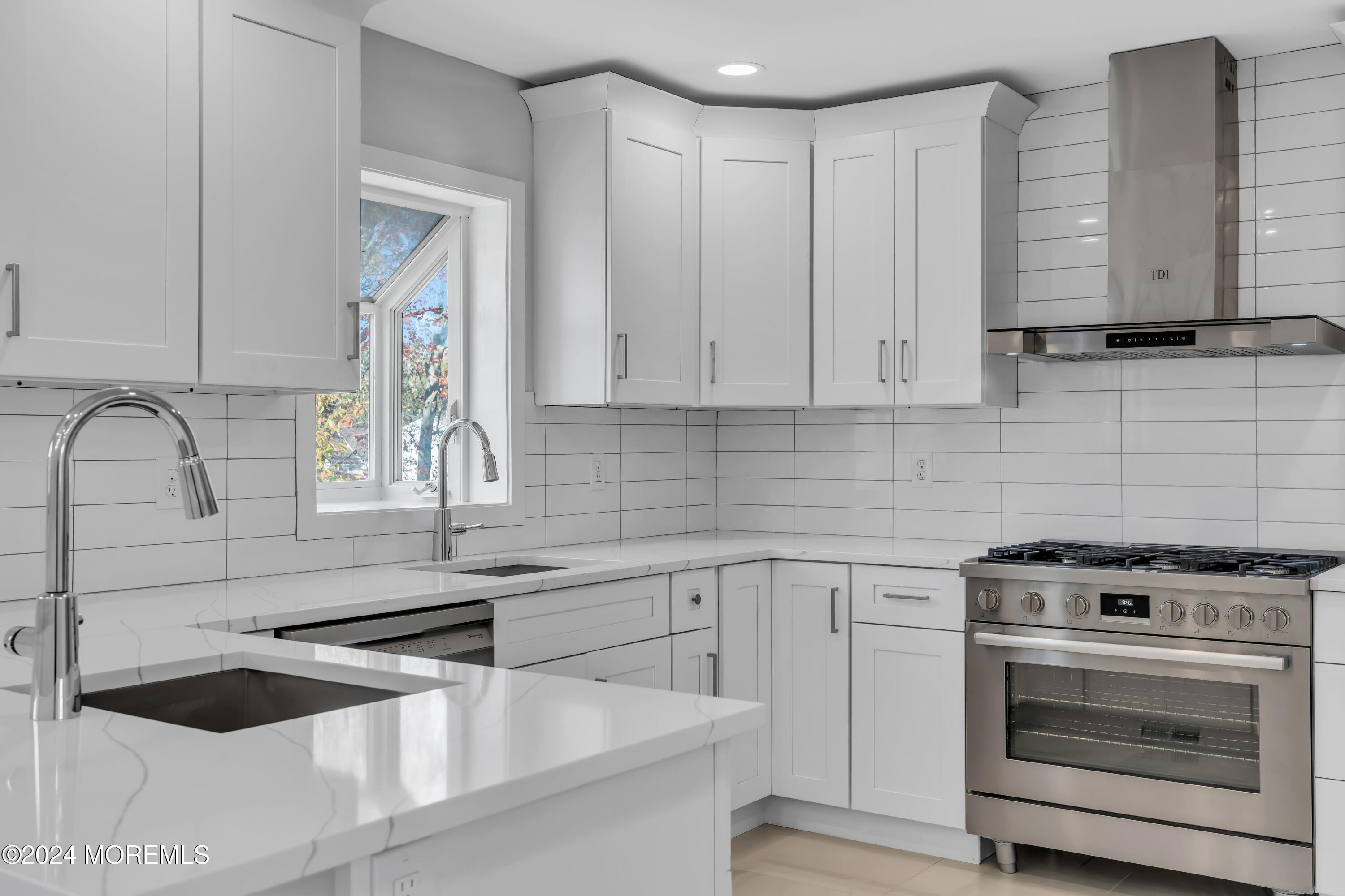 44 Lexington Road Howell, NJ 07731 - Photo 15 of 45 a kitchen with granite countertop white cabinets and white appliances