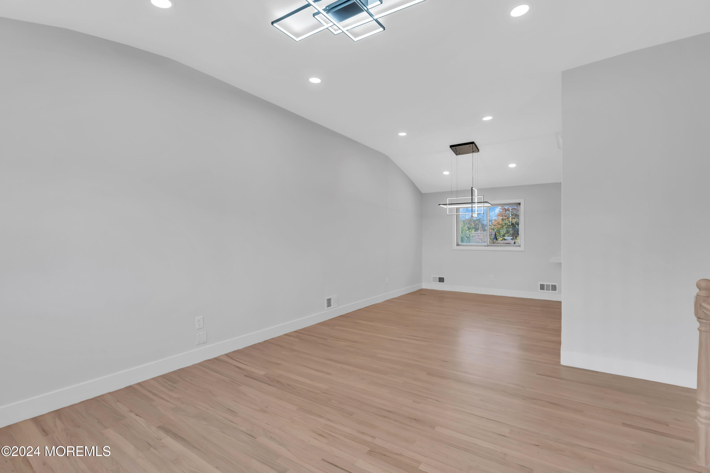 44 Lexington Road Howell, NJ 07731 - Photo 10 of 45 an empty room with a empty space and a ceiling fan