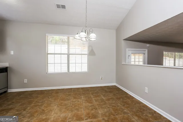 a kitchen with stainless steel appliances granite countertop a refrigerator stove a sink and dishwasher