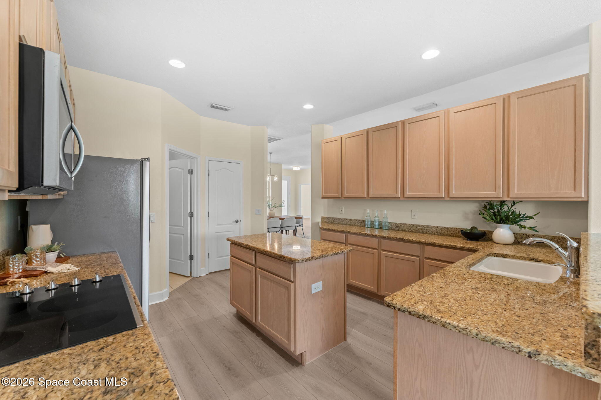 541 Oceanside Boulevard Indialantic, FL 32903 - Photo 11 of 51 a kitchen with a sink stove top oven and cabinets
