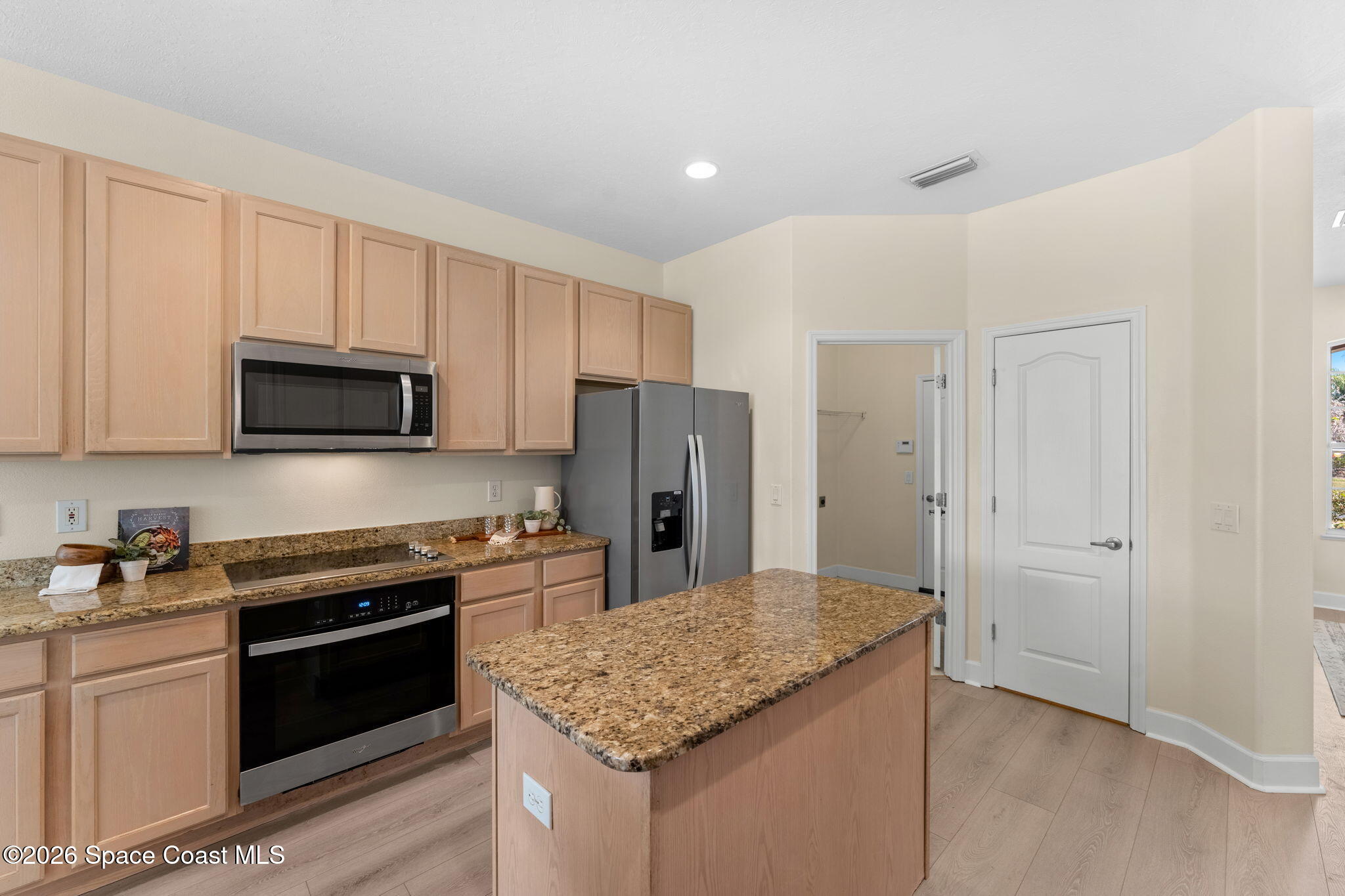 541 Oceanside Boulevard Indialantic, FL 32903 - Photo 12 of 51 a kitchen with stainless steel appliances granite countertop a stove and a refrigerator
