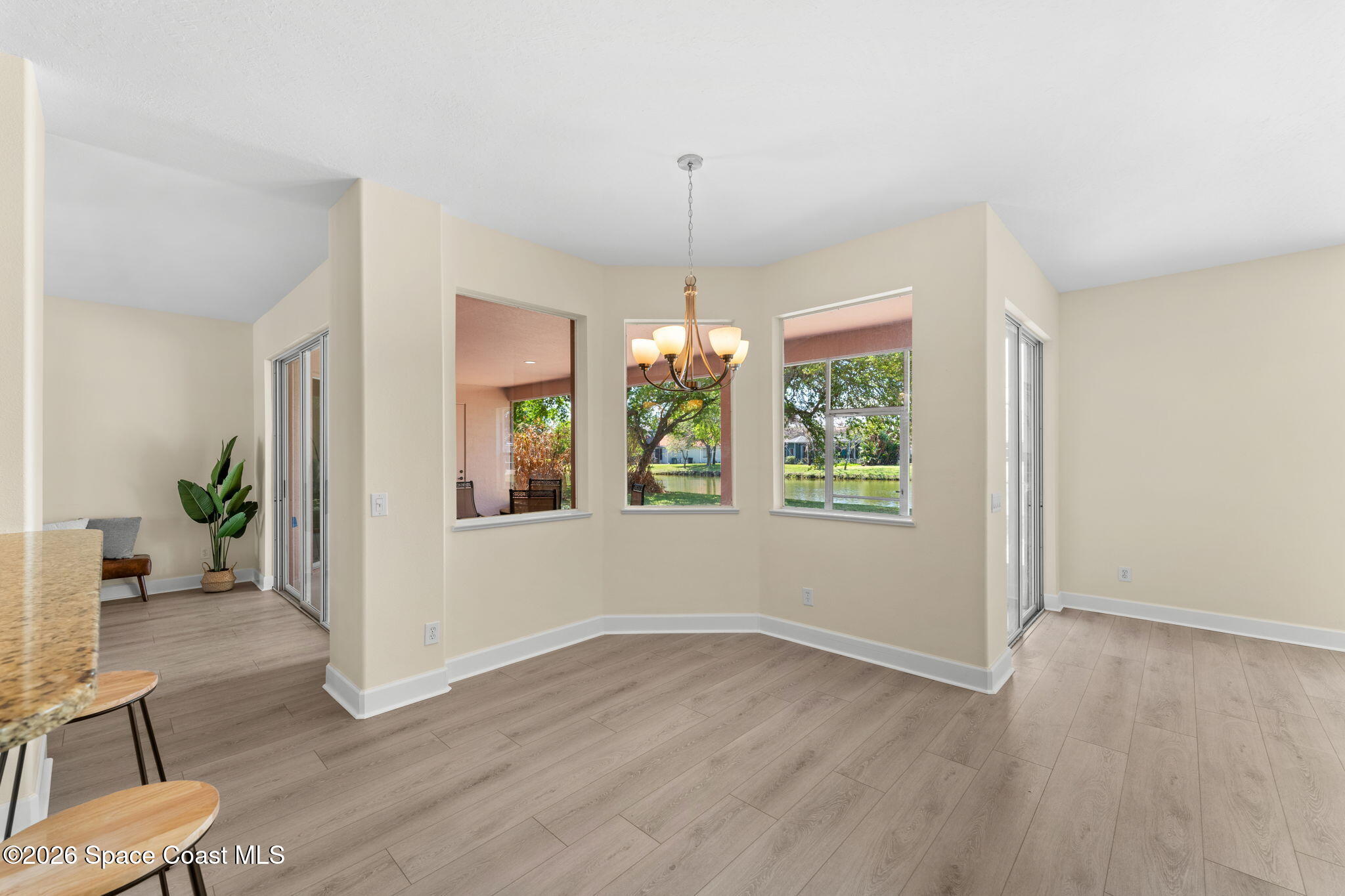 541 Oceanside Boulevard Indialantic, FL 32903 - Photo 13 of 51 a view of an empty room with window and wooden floor