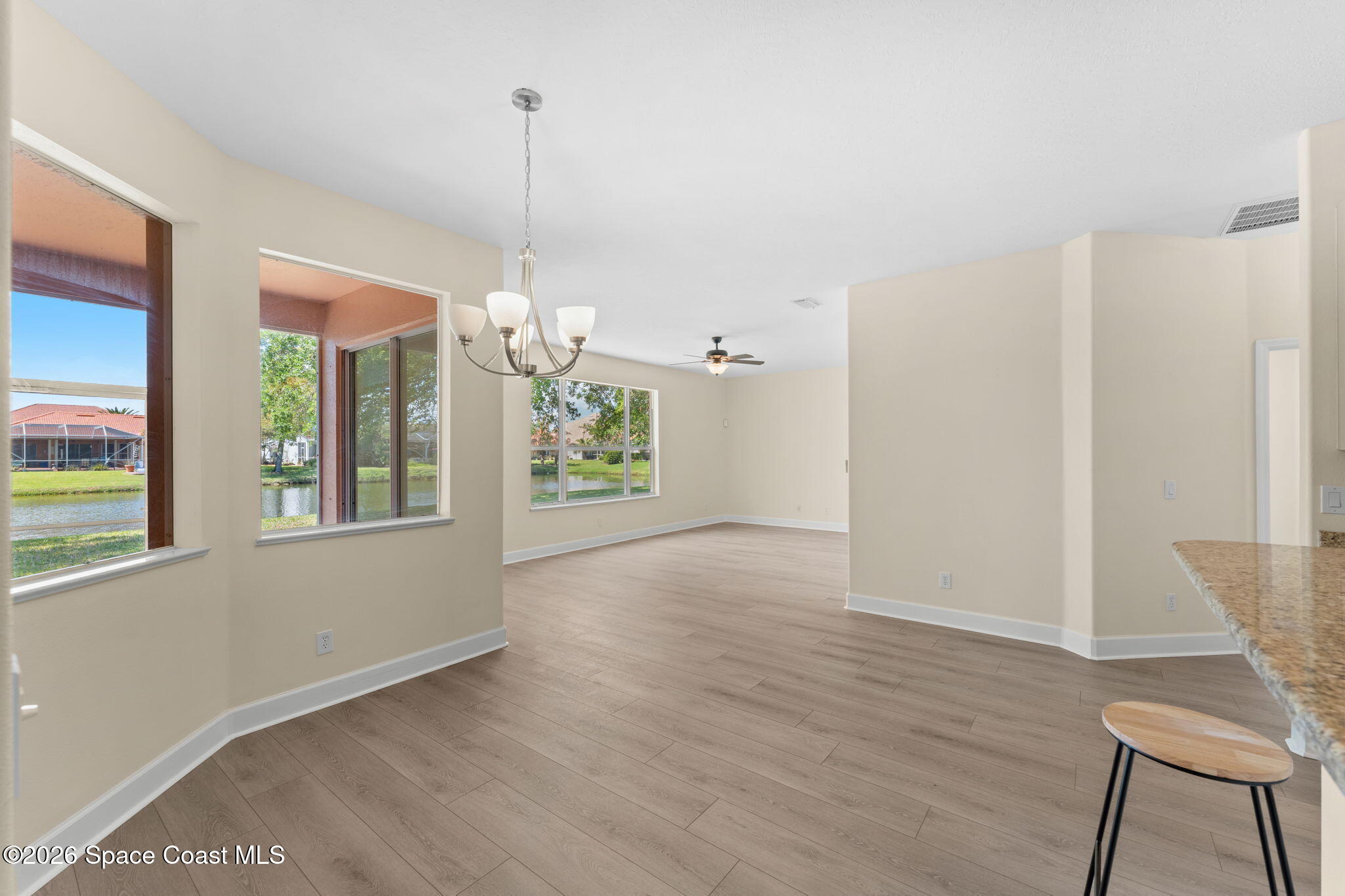 541 Oceanside Boulevard Indialantic, FL 32903 - Photo 14 of 51 a view of a room with wooden floor and entryway