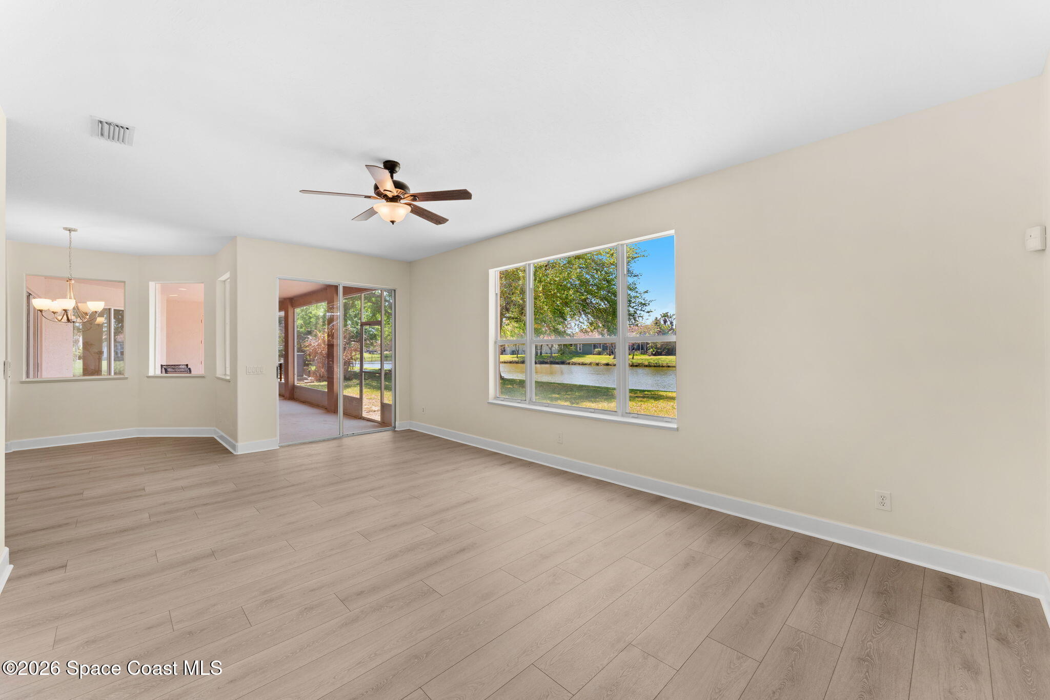 541 Oceanside Boulevard Indialantic, FL 32903 - Photo 16 of 51 wooden floor in an empty room with a window