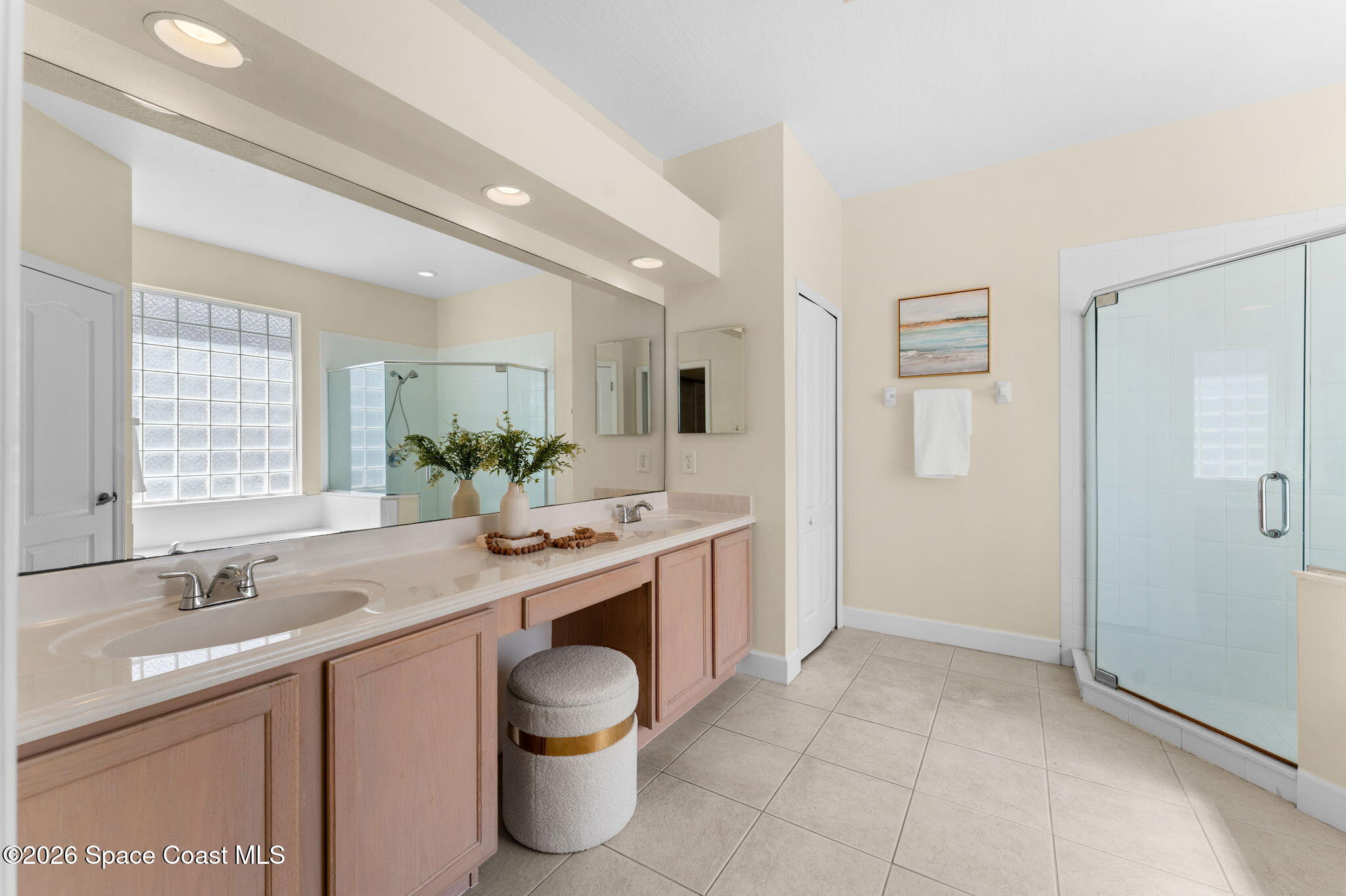 541 Oceanside Boulevard Indialantic, FL 32903 - Photo 23 of 51 a spacious bathroom with a granite countertop sink and a mirror