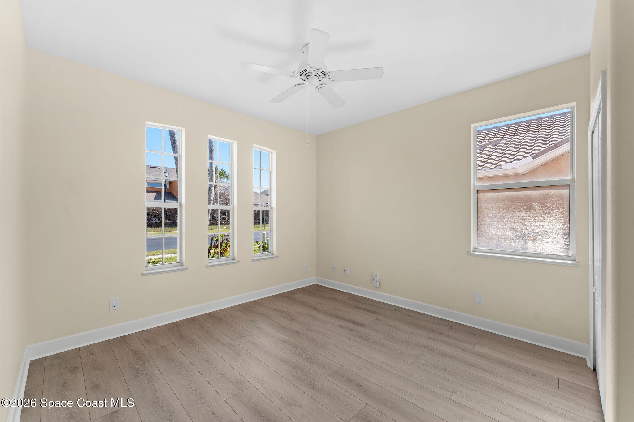 541 Oceanside Boulevard Indialantic, FL 32903 - Photo 27 of 51 an empty room with wooden floor closet and windows
