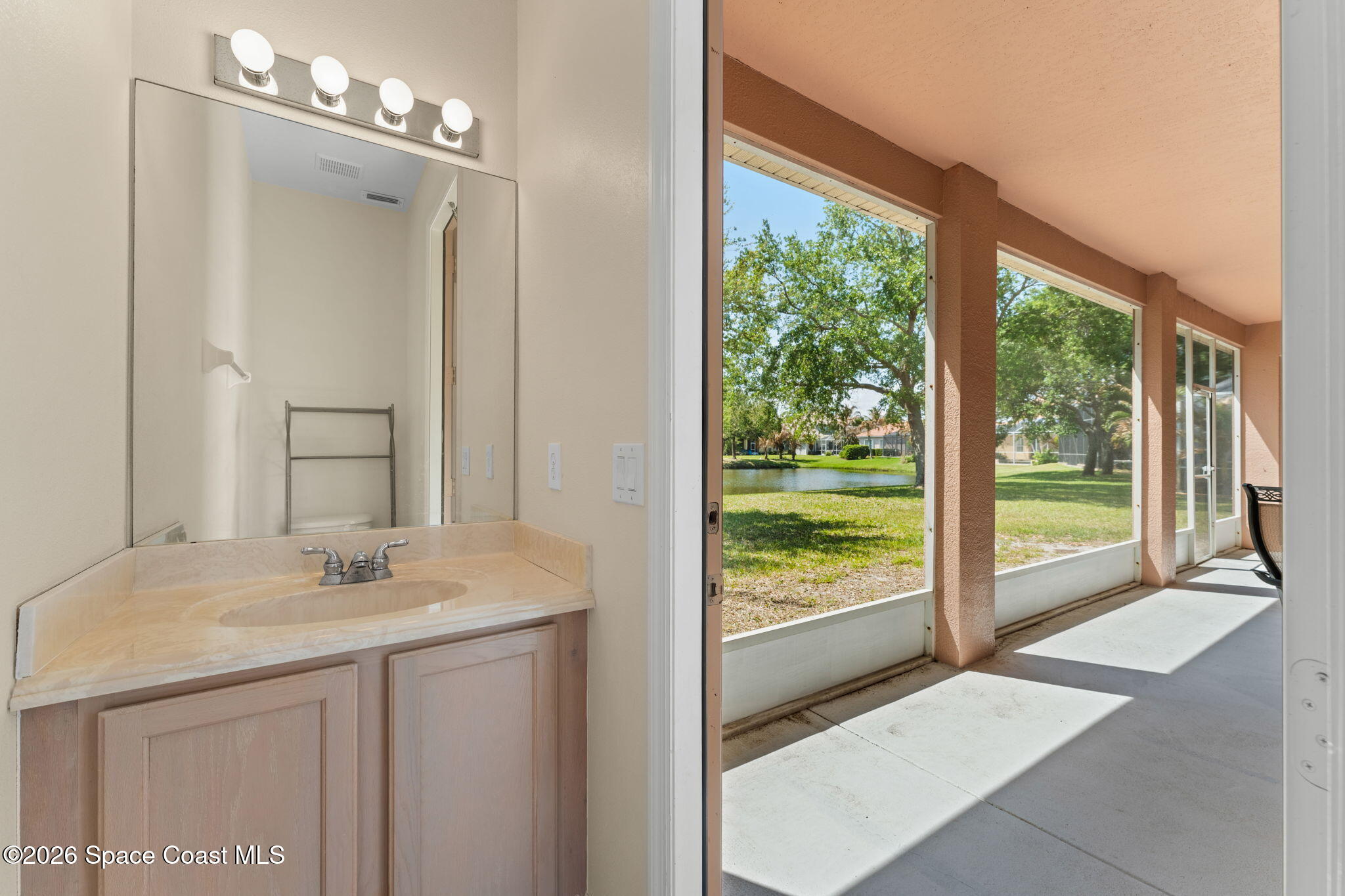 541 Oceanside Boulevard Indialantic, FL 32903 - Photo 30 of 51 a bathroom with a sink vanity and a mirror