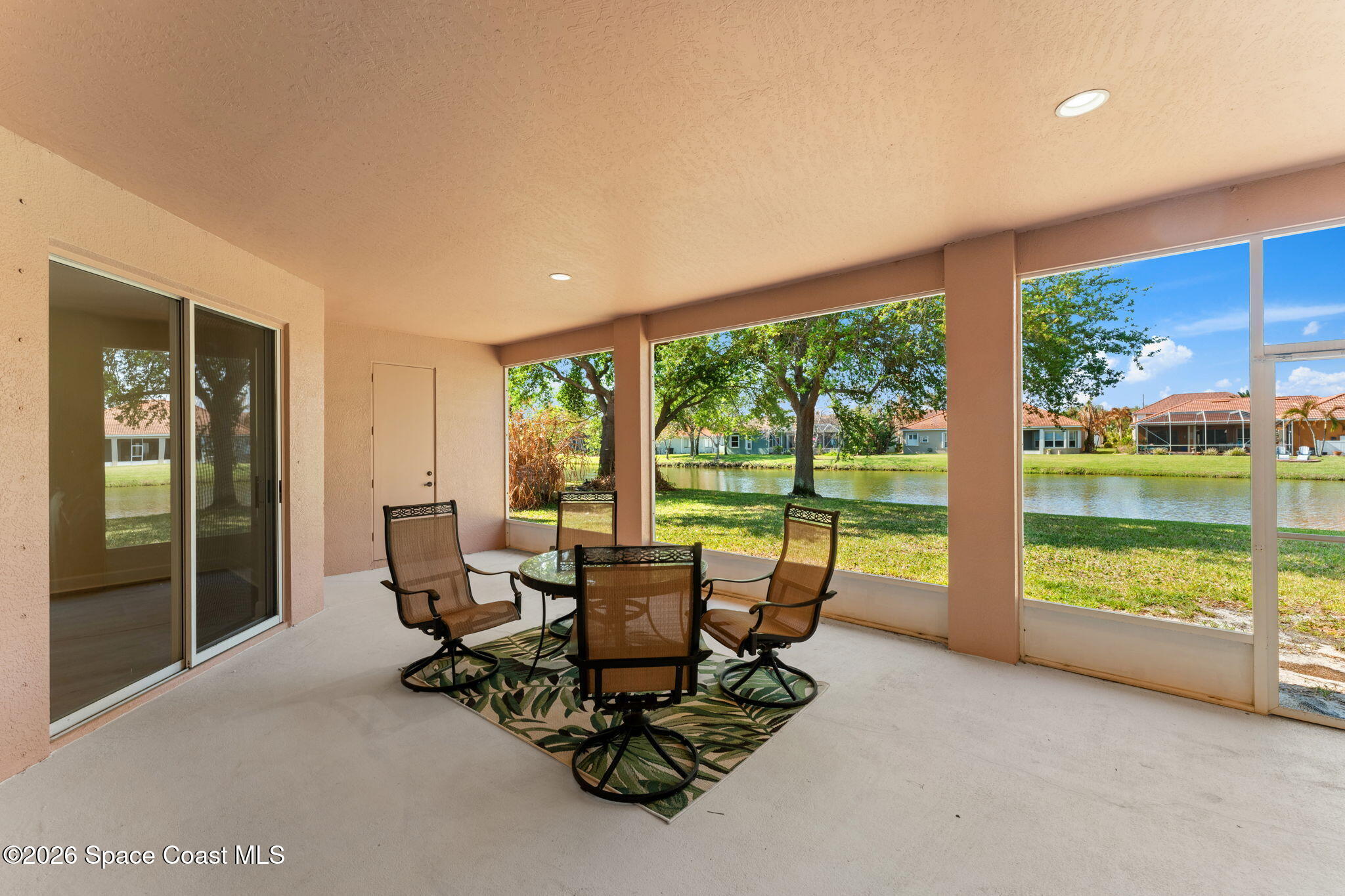 541 Oceanside Boulevard Indialantic, FL 32903 - Photo 31 of 51 a view of a city from a dining room with large windows and chairs